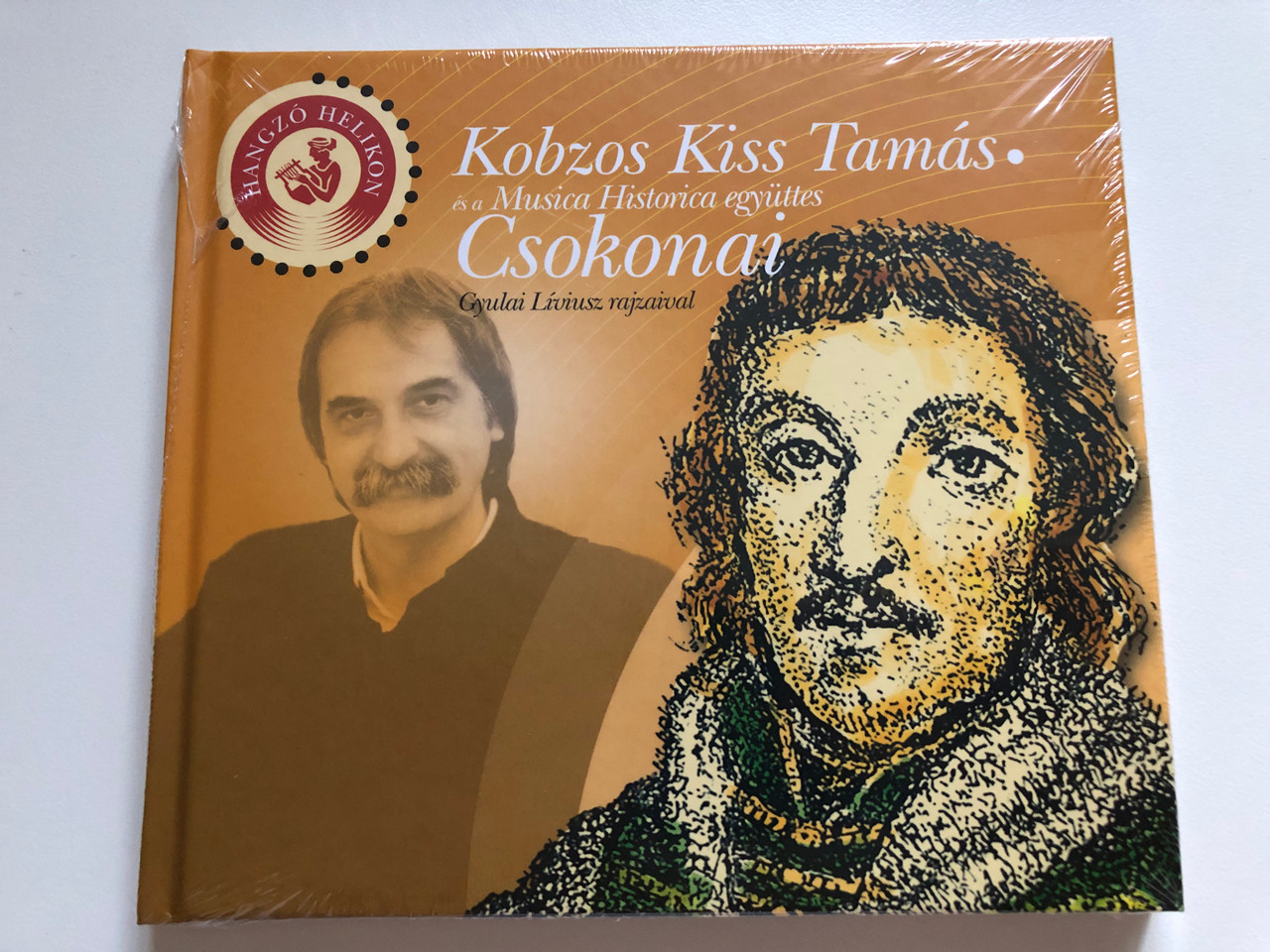 https://cdn10.bigcommerce.com/s-62bdpkt7pb/products/0/images/275199/Kobzos_Kiss_Tamas_Csokonai_-_es_a_Musica_Historica_egyuttes_Gyulai_Liviusz_rajzaival_Gryllus_Audio_CD_9789632088679_1__73779.1684836675.1280.1280.JPG?c=2&_gl=1*8r2do6*_ga*MjA2NTIxMjE2MC4xNTkwNTEyNTMy*_ga_WS2VZYPC6G*MTY4NDgzMDY5Ni45MDcuMS4xNjg0ODM2NjQ5LjYwLjAuMA..