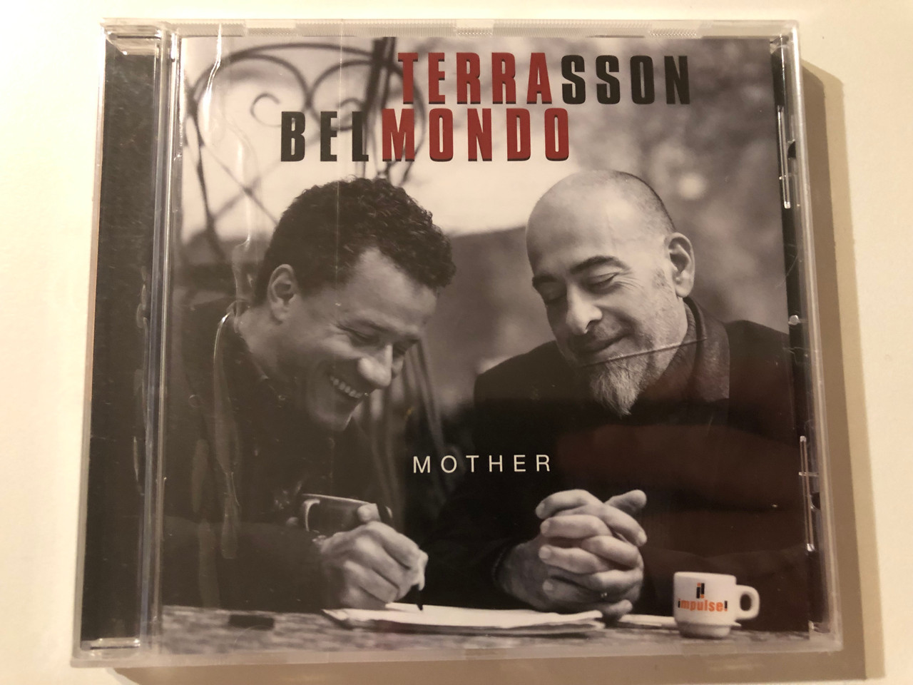 https://cdn10.bigcommerce.com/s-62bdpkt7pb/products/0/images/275720/Terrasson_Belmondo_Mother_Impulse_Audio_CD_2016_0602557049466_1__46621.1685512025.1280.1280.JPG?c=2&_gl=1*1jqrtov*_ga*MjA2NTIxMjE2MC4xNTkwNTEyNTMy*_ga_WS2VZYPC6G*MTY4NTUwNjU3OS45MTkuMS4xNjg1NTA4NDk2LjU0LjAuMA..