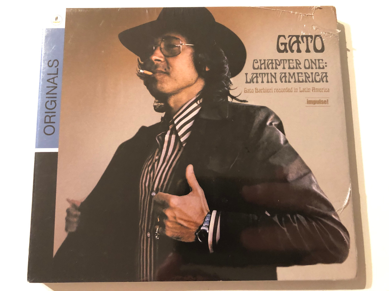 https://cdn10.bigcommerce.com/s-62bdpkt7pb/products/0/images/275830/Gato_-_Chapter_One_Latin_America_Gato_Barbieri_recorded_in_Latin_America_Impulse_Audio_CD_2009_0602517908963_1__19210.1685608054.1280.1280.JPG?c=2&_gl=1*jax1n2*_ga*MjA2NTIxMjE2MC4xNTkwNTEyNTMy*_ga_WS2VZYPC6G*MTY4NTU5ODY4Ni45MjEuMS4xNjg1NjA3ODM4LjQ1LjAuMA..