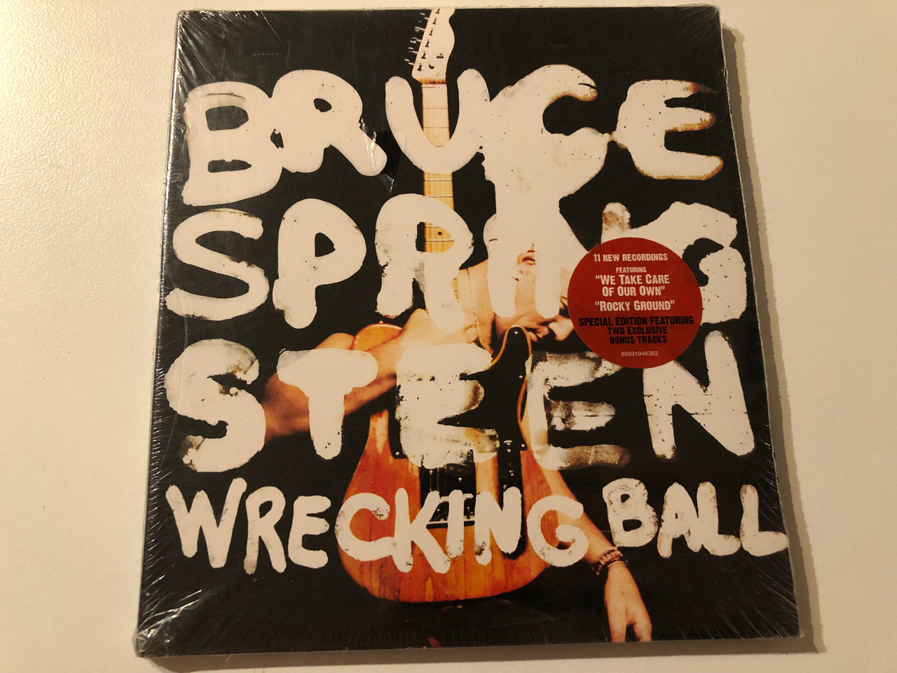 https://cdn10.bigcommerce.com/s-62bdpkt7pb/products/0/images/275887/Bruce_Springsteen_Wrecking_Ball_11_New_Recordings_Featuring_We_Take_Care_Of_Our_Own_Rocky_Ground._Special_Edition_Featuring_Two_Exclusive_Bonus_Tracks_Columbia_Audio_CD_2012_886_1__61362.1685687270.1280.1280.JPG?c=2&_gl=1*1m8cn8c*_ga*MjA2NTIxMjE2MC4xNTkwNTEyNTMy*_ga_WS2VZYPC6G*MTY4NTY4MzE3Mi45MjQuMS4xNjg1Njg3NzI0LjYwLjAuMA..