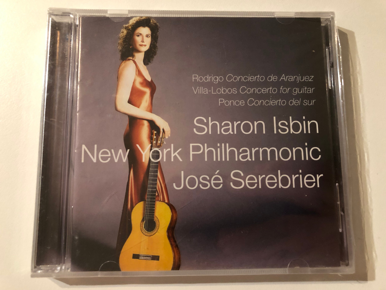 https://cdn10.bigcommerce.com/s-62bdpkt7pb/products/0/images/276210/Rodrigo_Concierto_De_Aranjuez_Villa-Lobos_Concerto_For_Guitar_Ponce_Concierto_Del_Sur_-_Sharon_Isbin_New_York_Philharmonic_Jos_Serebrier_Warner_Classics_Audio_CD_2004_2564_60296-2_1__49875.1686247518.1280.1280.JPG?c=2&_gl=1*duunhl*_ga*MjA2NTIxMjE2MC4xNTkwNTEyNTMy*_ga_WS2VZYPC6G*MTY4NjIzOTQ0OS45MzMuMS4xNjg2MjQ2NTEwLjE5LjAuMA..
