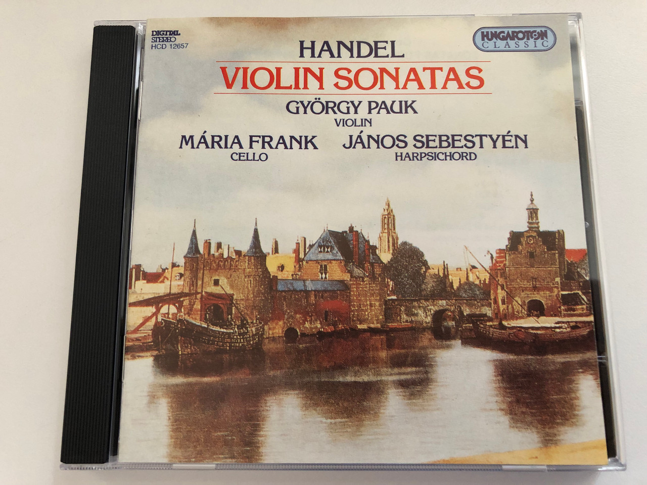 https://cdn10.bigcommerce.com/s-62bdpkt7pb/products/0/images/279016/Handel_Violin_Sonatas_-_Gyrgy_Pauk_violin_Mria_Frank_cello_Jnos_Sebestyn_harpsichord_Hungaroton_Classic_Audio_CD_1994_Stereo_HCD_12657_1__41170.1687757674.1280.1280.JPG?c=2&_gl=1*1w68p0j*_ga*MjA2NTIxMjE2MC4xNTkwNTEyNTMy*_ga_WS2VZYPC6G*MTY4Nzc0ODc4My45NjIuMS4xNjg3NzU3NTMyLjU5LjAuMA..