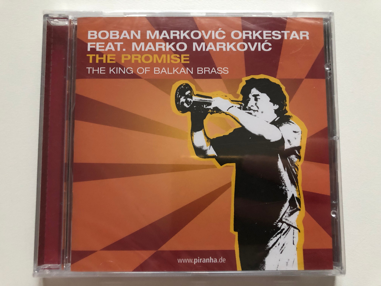 https://cdn10.bigcommerce.com/s-62bdpkt7pb/products/0/images/279046/Boban_Markovi_Orkestar_Feat._Marko_Markovi_The_Promise_-_The_King_Of_Balkan_Brass_Piranha_Audio_CD_CD-PIR1901_1__03384.1687762493.1280.1280.JPG?c=2&_gl=1*1fpy6e0*_ga*MjA2NTIxMjE2MC4xNTkwNTEyNTMy*_ga_WS2VZYPC6G*MTY4Nzc0ODc4My45NjIuMS4xNjg3NzYyMTIwLjU4LjAuMA..