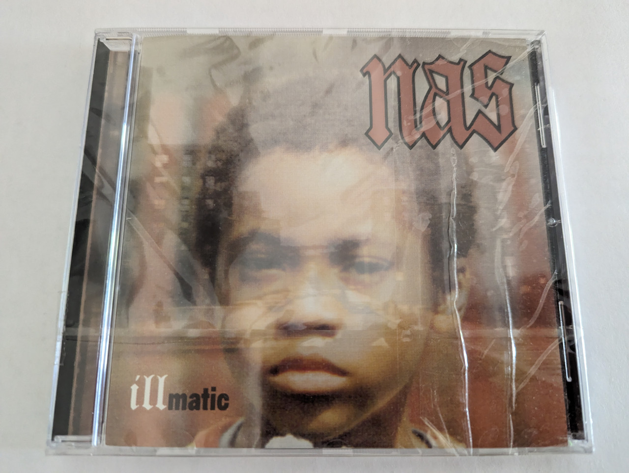 https://cdn10.bigcommerce.com/s-62bdpkt7pb/products/0/images/279350/Nas_-_Illmatic_Columbia_Audio_CD_475959_2_1__51822.1687850798.1280.1280.jpg?c=2&_gl=1*131spda*_ga*MjA2NTIxMjE2MC4xNTkwNTEyNTMy*_ga_WS2VZYPC6G*MTY4Nzg0NjM3Ni45NjYuMS4xNjg3ODUwODA0LjYwLjAuMA..