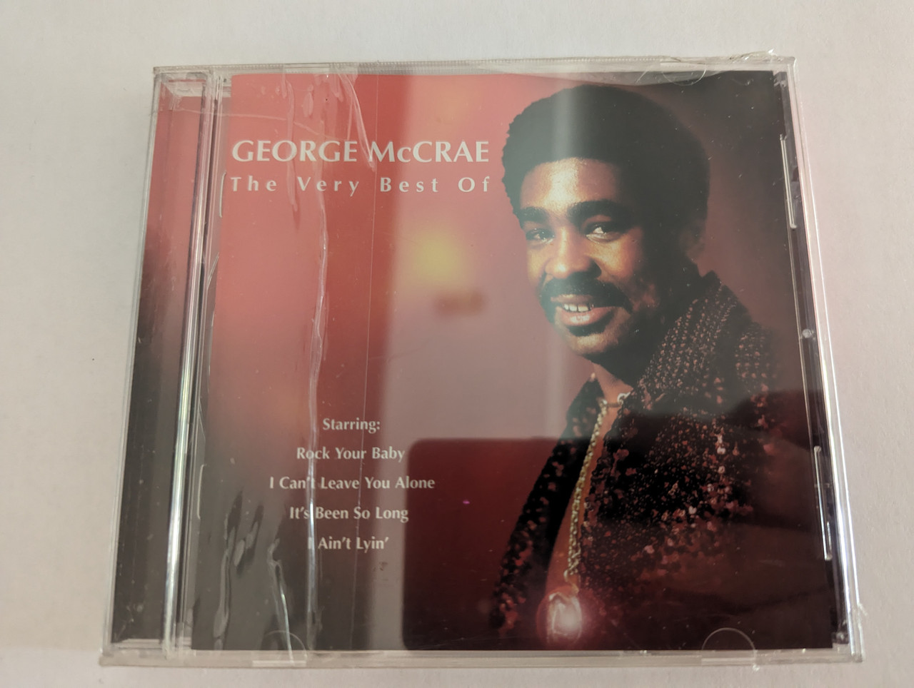 https://cdn10.bigcommerce.com/s-62bdpkt7pb/products/0/images/279395/George_McCrae_The_Very_Best_Of_Starring_Rock_Your_Baby_I_Cant_Leave_You_Alone_Its_Been_So_Long_I_Aint_Lyin_EMI_Gold_Audio_CD_2001_724353296223_1__58180.1687856116.1280.1280.jpg?c=2&_gl=1*2hlnke*_ga*MjA2NTIxMjE2MC4xNTkwNTEyNTMy*_ga_WS2VZYPC6G*MTY4Nzg0NjM3Ni45NjYuMS4xNjg3ODU1NTc3LjI5LjAuMA..