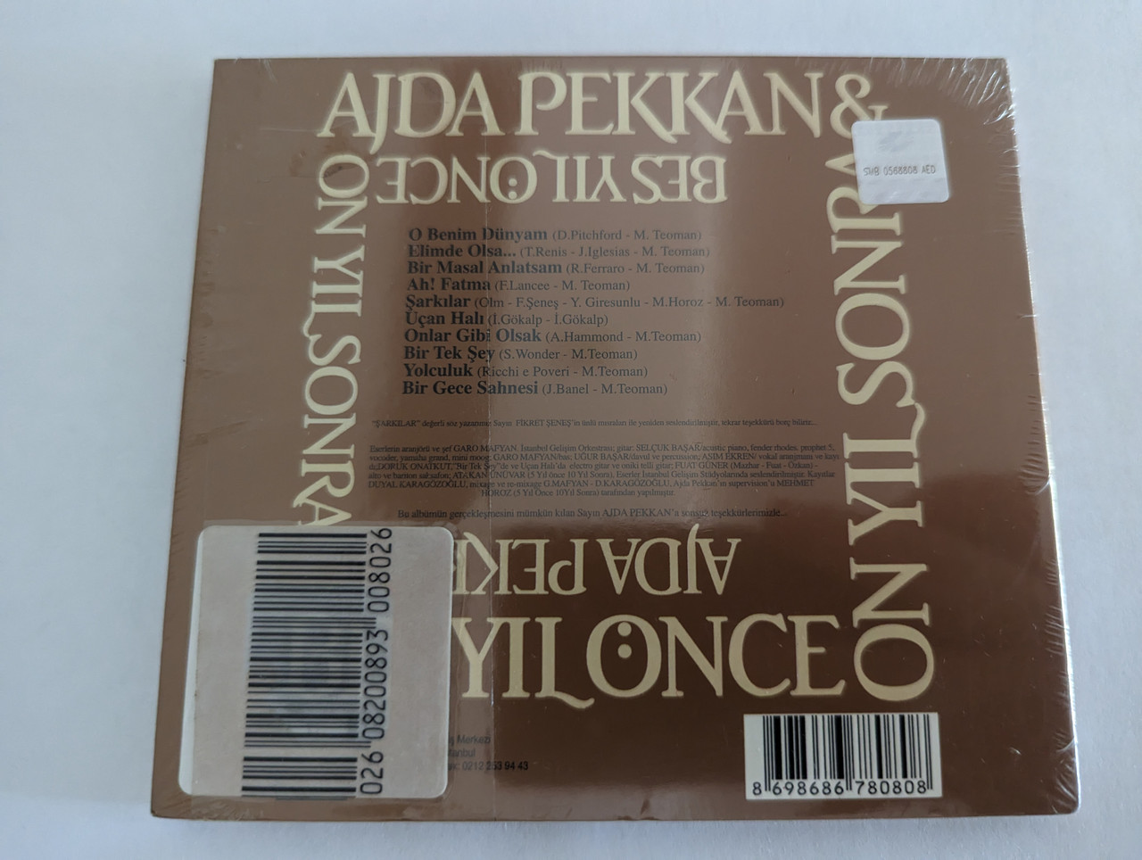 https://cdn10.bigcommerce.com/s-62bdpkt7pb/products/0/images/279405/Ajda_Pekkan_Be_Yl_nce_On_Yl_Sonra_Ossi_Mzik_Audio_CD_2010_Ossi-070_2__50545.1687857699.1280.1280.jpg?c=2&_gl=1*dkp7g0*_ga*MjA2NTIxMjE2MC4xNTkwNTEyNTMy*_ga_WS2VZYPC6G*MTY4Nzg0NjM3Ni45NjYuMS4xNjg3ODU3NTc2LjYwLjAuMA..