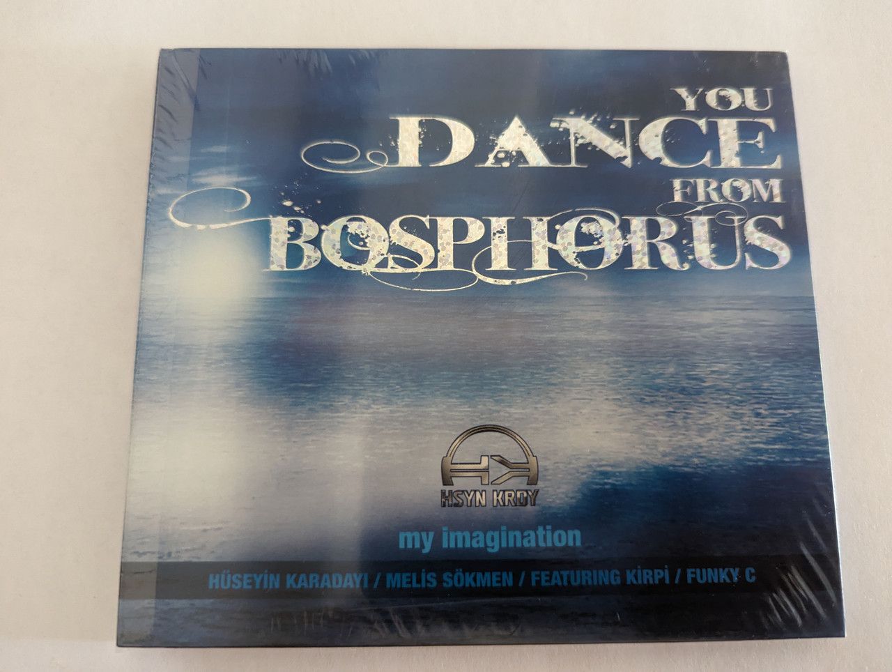 https://cdn10.bigcommerce.com/s-62bdpkt7pb/products/0/images/279419/You_Dance_From_Bosphorus_My_Imagination_Huseyin_Karadayi_Melis_Sokmen_Featuring_Kirpi_Funky_C_Ozan_Video_Film_Audio_CD_2008_0212_2273729_1__69676.1687859865.1280.1280.jpg?c=2&_gl=1*cn5469*_ga*MjA2NTIxMjE2MC4xNTkwNTEyNTMy*_ga_WS2VZYPC6G*MTY4Nzg0NjM3Ni45NjYuMS4xNjg3ODU5OTQ0LjYwLjAuMA..
