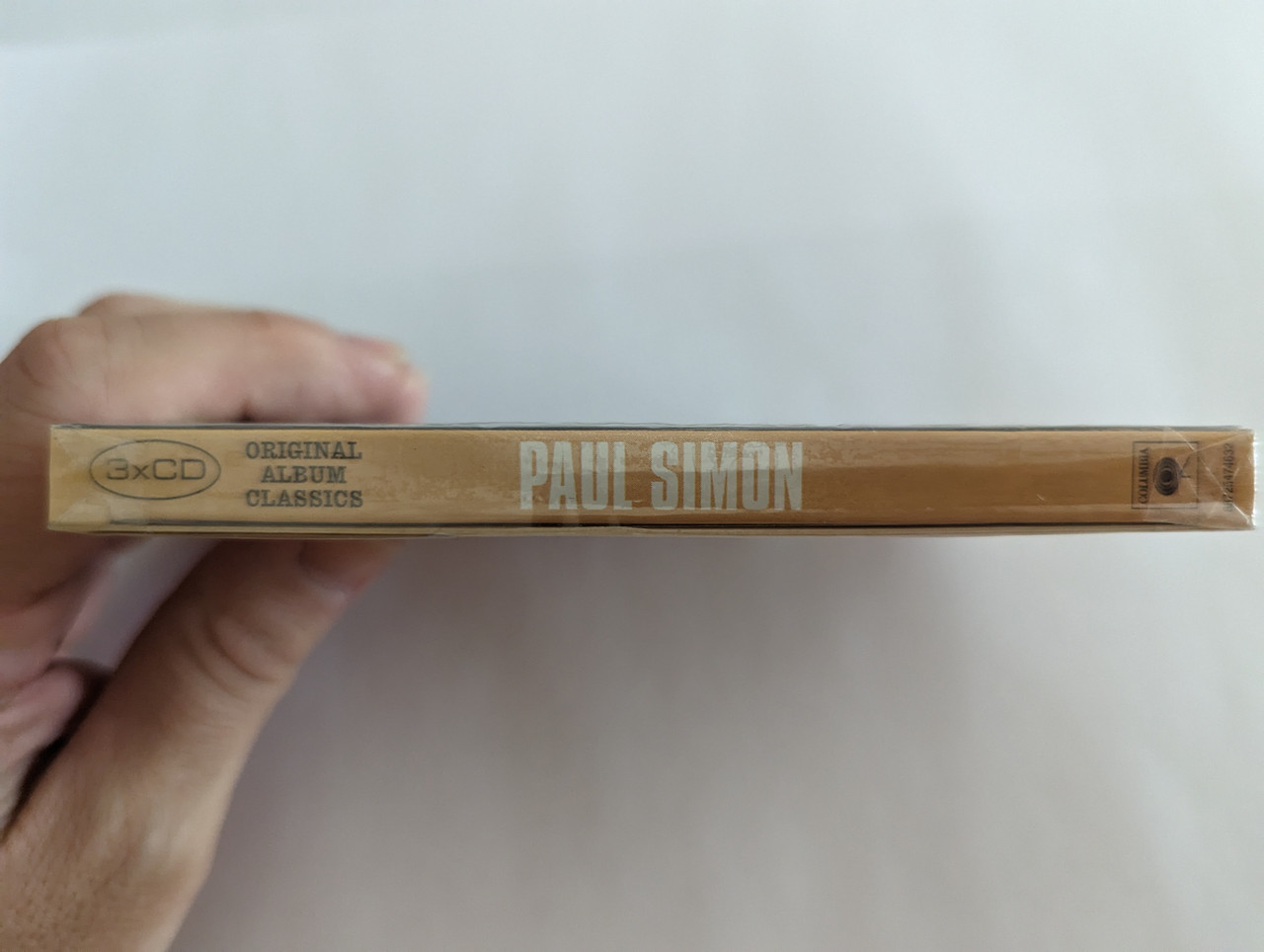 https://cdn10.bigcommerce.com/s-62bdpkt7pb/products/0/images/279659/Paul_Simon_Original_Album_Classics_Sony_Music_3x_Audio_CD_Box_Set_2012_88725474632_3__69558.1687930392.1280.1280.jpg?c=2&_gl=1*or8ytp*_ga*MjA2NTIxMjE2MC4xNTkwNTEyNTMy*_ga_WS2VZYPC6G*MTY4NzkzMDI4OC45NjcuMC4xNjg3OTMwMjg4LjYwLjAuMA..