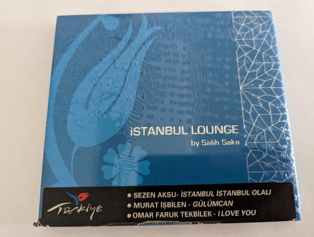 https://cdn10.bigcommerce.com/s-62bdpkt7pb/products/0/images/279687/stanbul_Lounge_By_Salih_Saka_Sezen_Aksu_-_stanbul_stanbul_Olali_Murat_blen_-_Glmcan_mer_Faruk_Tekblek_-_I_Love_You_Yeni_Dnya_Audio_CD_12687_1__06686.1687936214.1280.1280.jpg?c=2&_gl=1*1298kh2*_ga*MjA2NTIxMjE2MC4xNTkwNTEyNTMy*_ga_WS2VZYPC6G*MTY4NzkzMDI4OC45NjcuMS4xNjg3OTM1OTY5LjUzLjAuMA..