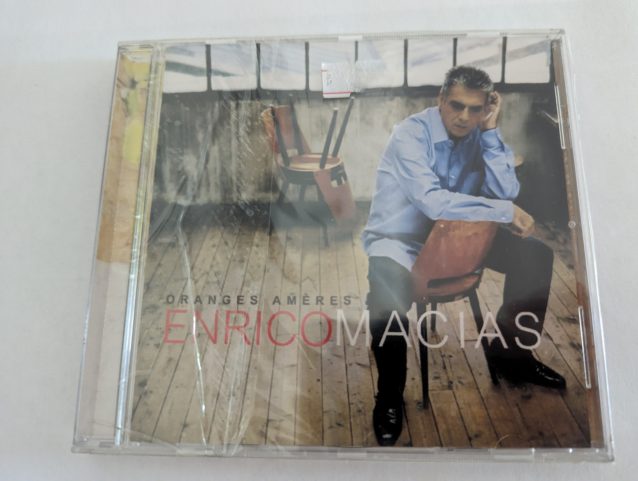 https://cdn10.bigcommerce.com/s-62bdpkt7pb/products/0/images/279690/Enrico_Macias_Oranges_Amres_Trema_Audio_CD_2003_710834_1__67952.1687936623.1280.1280.jpg?c=2&_gl=1*1it00nn*_ga*MjA2NTIxMjE2MC4xNTkwNTEyNTMy*_ga_WS2VZYPC6G*MTY4NzkzMDI4OC45NjcuMS4xNjg3OTM2Mzg0LjI3LjAuMA..
