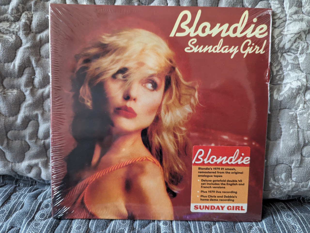 https://cdn10.bigcommerce.com/s-62bdpkt7pb/products/0/images/282474/Blondie_Sunday_Girl_Blondies_1979_1_smash_remastered_from_the_original_analogue_tapes._Deluxe_gatefold_double_45_set_includes_the_English_and_French_versions_Plus_1979_live_recording_1__54657.1688974538.1280.1280.jpg?c=2&_gl=1*1nip19y*_ga*MjA2NTIxMjE2MC4xNTkwNTEyNTMy*_ga_WS2VZYPC6G*MTY4ODk2OTUyNS45ODEuMS4xNjg4OTczNzc1LjQzLjAuMA..