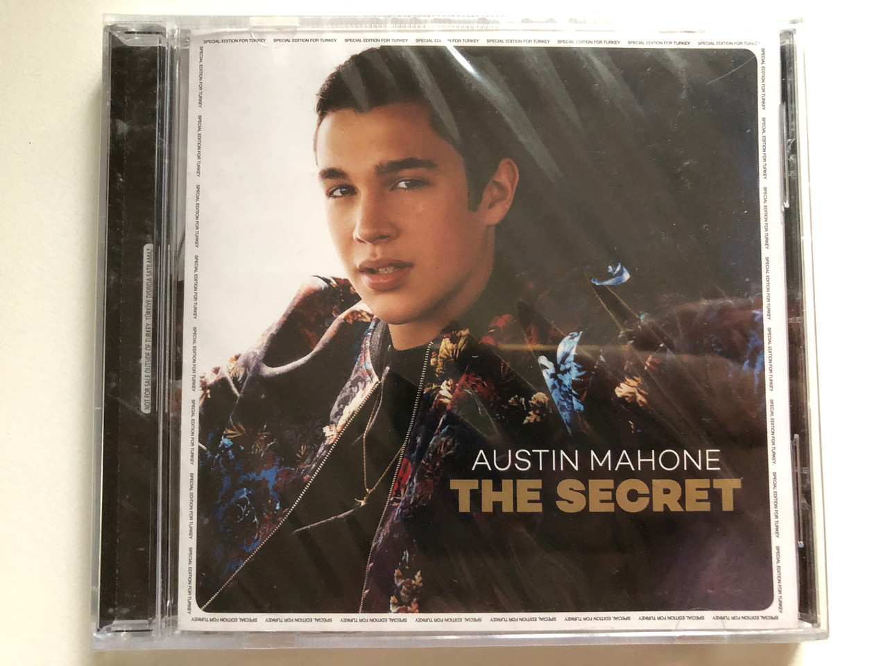 https://cdn10.bigcommerce.com/s-62bdpkt7pb/products/0/images/283309/Austin_Mahone_The_Secret_Avrupa_Mzik_Audio_CD_2014_378522-4_1__51895.1689245663.1280.1280.JPG?c=2&_gl=1*t8kpzv*_ga*MjA2NTIxMjE2MC4xNTkwNTEyNTMy*_ga_WS2VZYPC6G*MTY4OTIzMjkxMy45ODMuMS4xNjg5MjQ1NTQwLjU1LjAuMA..