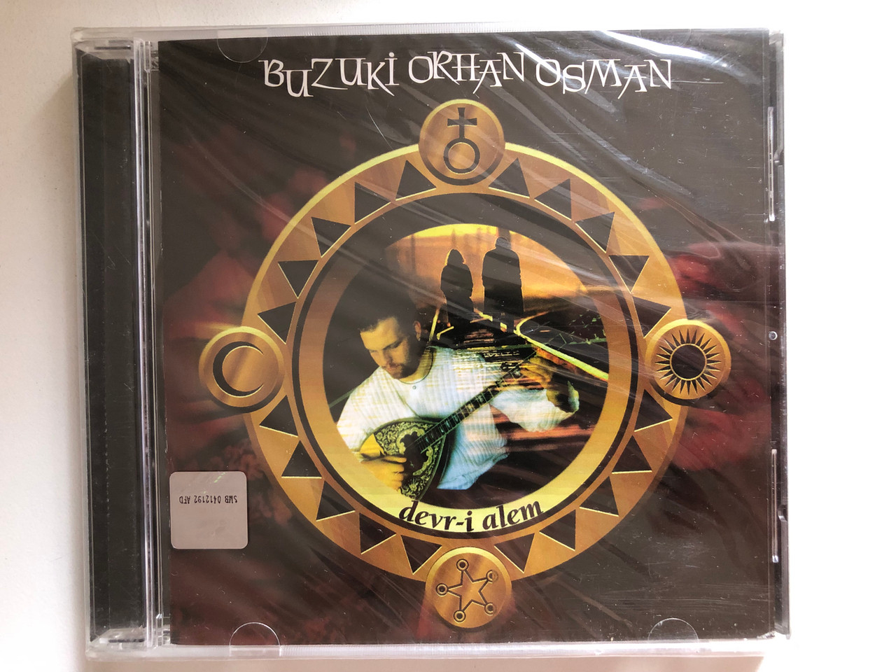 https://cdn10.bigcommerce.com/s-62bdpkt7pb/products/0/images/284578/Buzuki_Orhan_Osman_Devr-i_Alem_Ada_Mzik_Audio_CD_2002_1__41177.1689599029.1280.1280.JPG?c=2&_gl=1*poc531*_ga*MjA2NTIxMjE2MC4xNTkwNTEyNTMy*_ga_WS2VZYPC6G*MTY4OTU5Mzg0OC45ODcuMS4xNjg5NTk4NjU5LjU1LjAuMA..