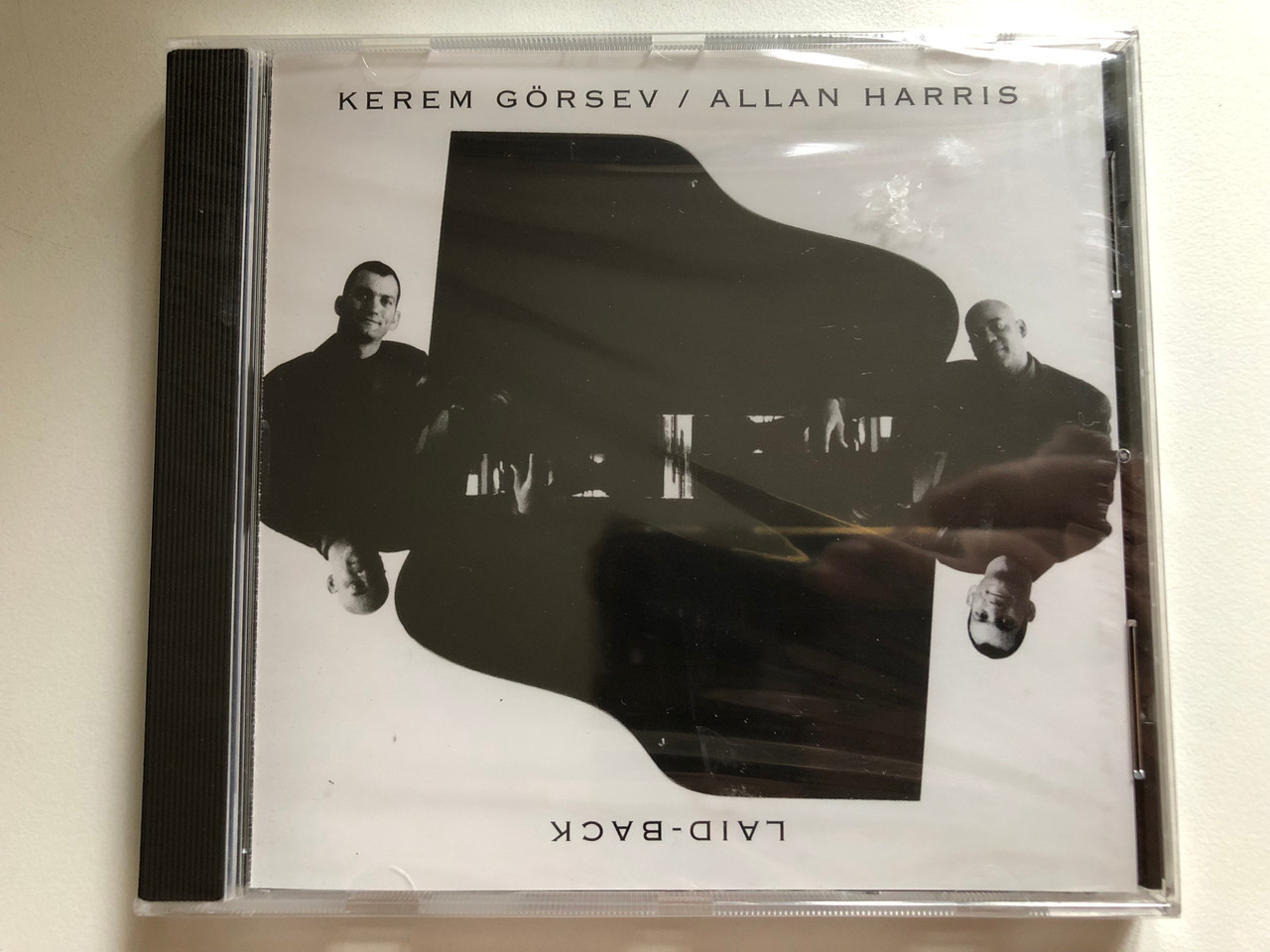 https://cdn10.bigcommerce.com/s-62bdpkt7pb/products/0/images/284584/Kerem_Grsev_Allan_Harris_Laid-Black_Universal_Audio_CD_1999_9722012_1__99909.1689602472.1280.1280.JPG?c=2&_gl=1*1eqleb8*_ga*MjA2NTIxMjE2MC4xNTkwNTEyNTMy*_ga_WS2VZYPC6G*MTY4OTU5Mzg0OC45ODcuMS4xNjg5NjAyMDQ4LjE0LjAuMA..