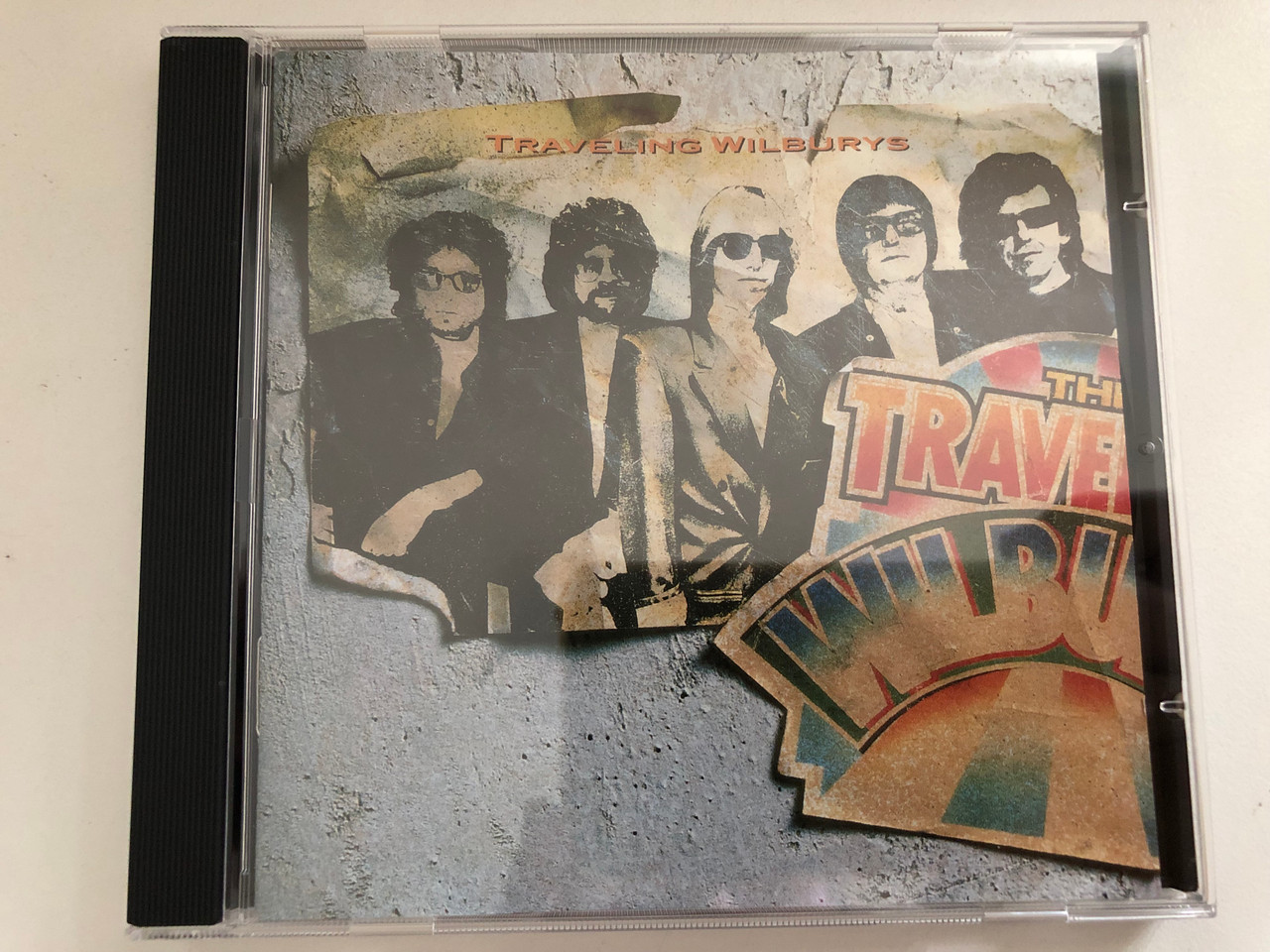 https://cdn10.bigcommerce.com/s-62bdpkt7pb/products/0/images/287234/Traveling_Wilburys_Vol._1_Wilbury_Records_Audio_CD_1988_7599-25796-2_1__34902.1690191986.1280.1280.JPG?c=2&_gl=1*ix62k6*_ga*MjA2NTIxMjE2MC4xNTkwNTEyNTMy*_ga_WS2VZYPC6G*MTY5MDE3ODQ1Ni45OTMuMS4xNjkwMTkyMDIyLjYwLjAuMA..