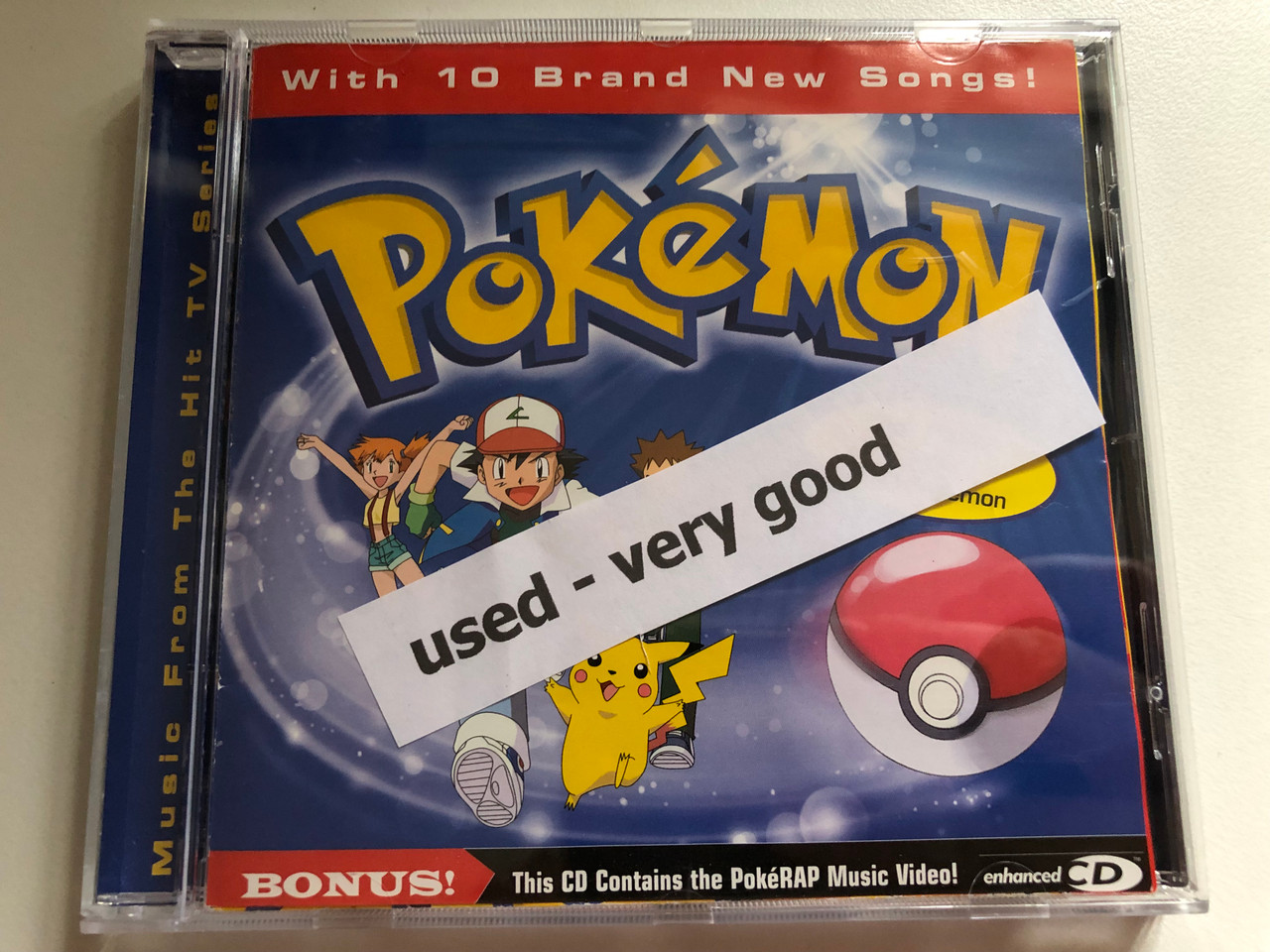 https://cdn10.bigcommerce.com/s-62bdpkt7pb/products/0/images/287394/Pokmon_-_With_10_Brand_New_Songs_Incl._Poster_with_150_Pokmon_BONUS_This_CD_Contains_the_PokeRAP_Music_Video_Edel_Audio_CD_1999_0069852ERE_9__53543.1690272399.1280.1280.JPG?c=2&_gl=1*1op7yf2*_ga*MjA2NTIxMjE2MC4xNTkwNTEyNTMy*_ga_WS2VZYPC6G*MTY5MDI2NTMxNy45OTUuMS4xNjkwMjcxODAzLjQ4LjAuMA..