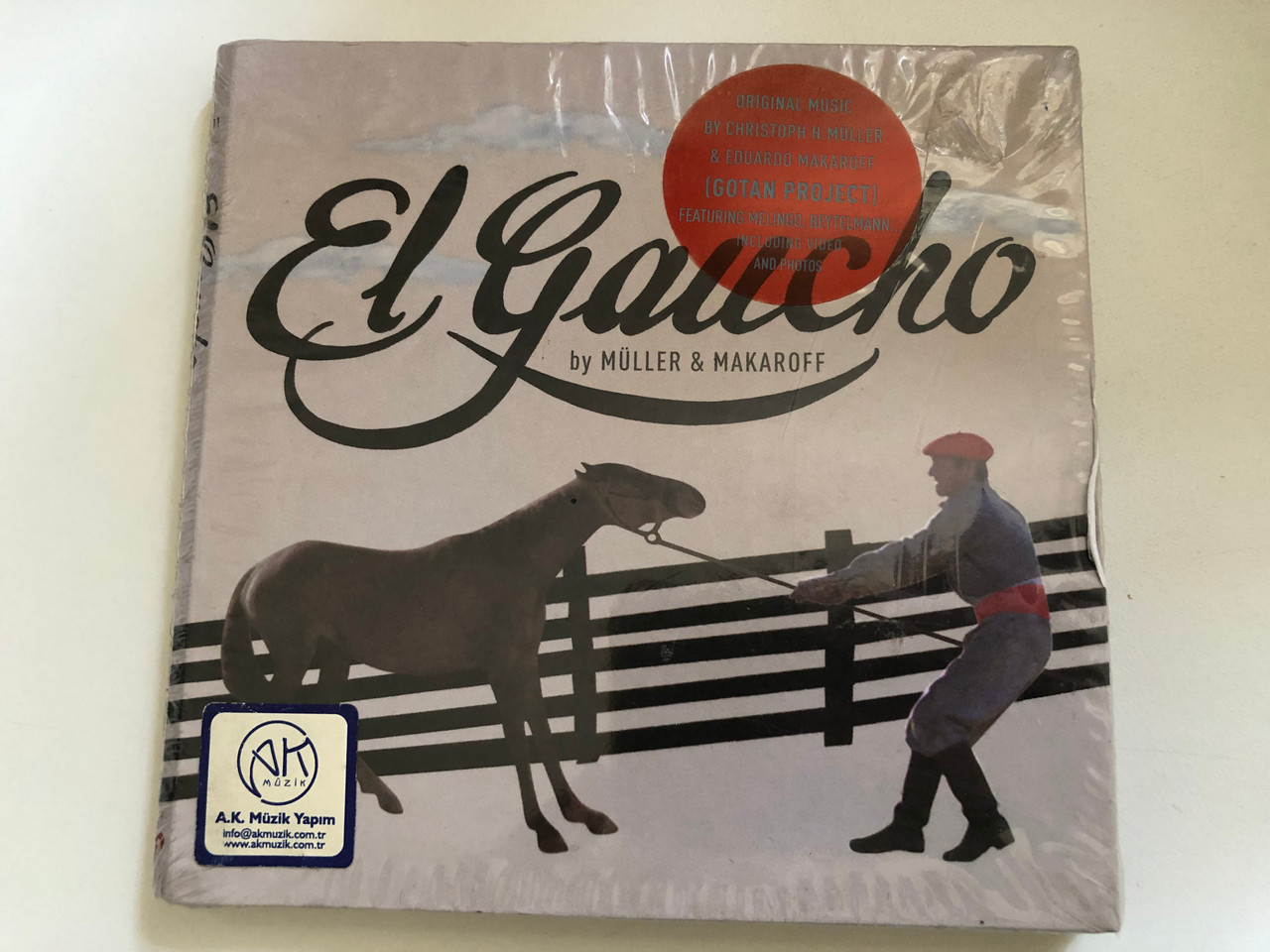 https://cdn10.bigcommerce.com/s-62bdpkt7pb/products/0/images/287660/El_Gaucho_By_Mller_Makaroff_Original_Music_By_Christoph_H._Mller_Eduardo_Makaroff_Featuring_Melingo_Beytelmann..._Including_Video_And_Photos_Maana_Audio_CD_2008_MM425011_1__21506.1690351675.1280.1280.JPG?c=2&_gl=1*11ldrsj*_ga*MjA2NTIxMjE2MC4xNTkwNTEyNTMy*_ga_WS2VZYPC6G*MTY5MDM0ODgwMi45OTYuMS4xNjkwMzUxNjgxLjYwLjAuMA..
