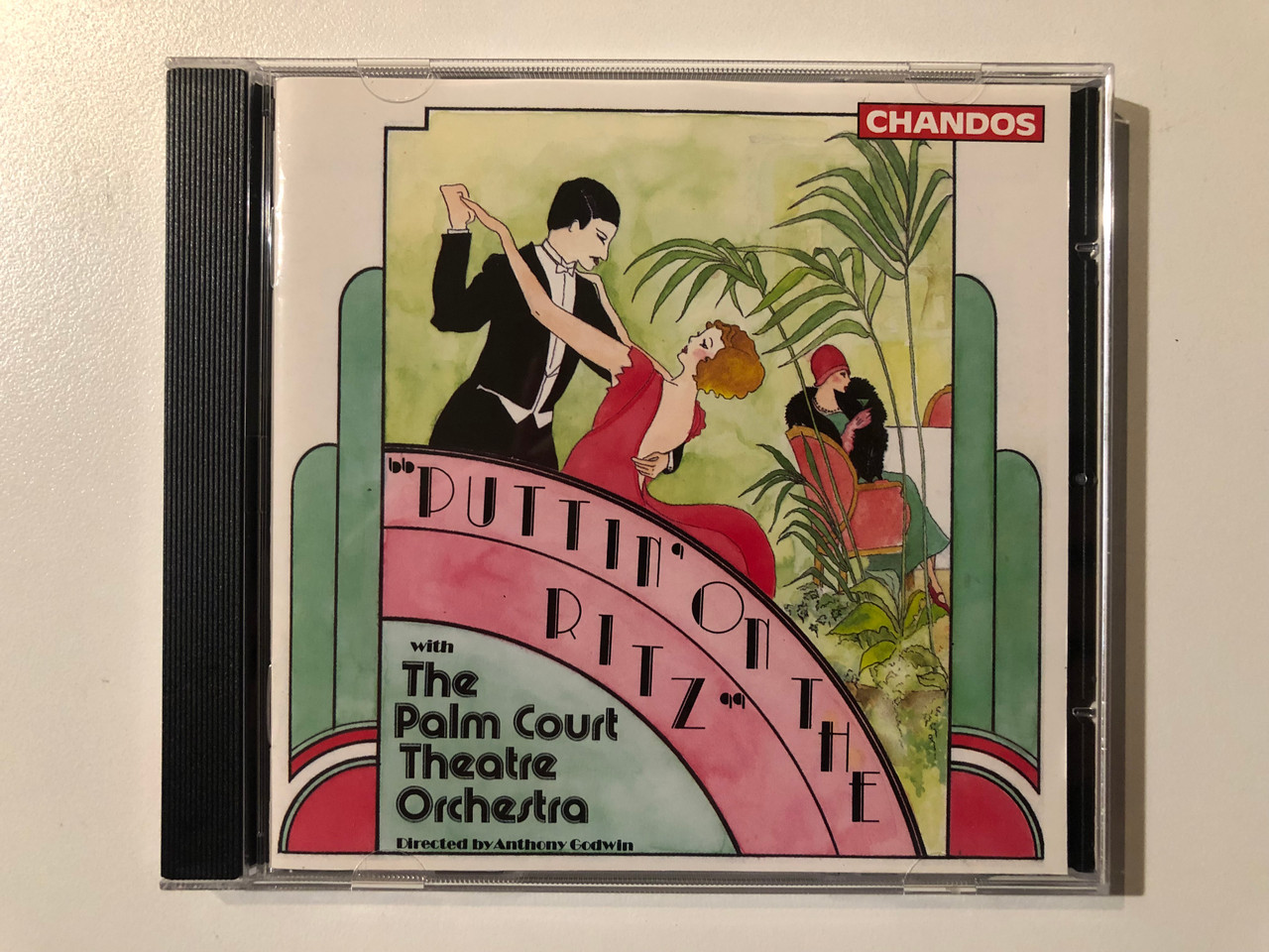 https://cdn10.bigcommerce.com/s-62bdpkt7pb/products/0/images/289566/Puttin_On_The_Ritz_-_With_The_Palm_Court_Theatre_Orchestra_Directed_By_Anthony_Godwin_Chandos_Audio_CD_1990_CHAN_8703_1__04727.1690994358.1280.1280.JPG?c=2&_gl=1*1popk26*_ga*MjA2NTIxMjE2MC4xNTkwNTEyNTMy*_ga_WS2VZYPC6G*MTY5MDk4NDE2OC4xMDA0LjEuMTY5MDk5NDIzMC41OS4wLjA.