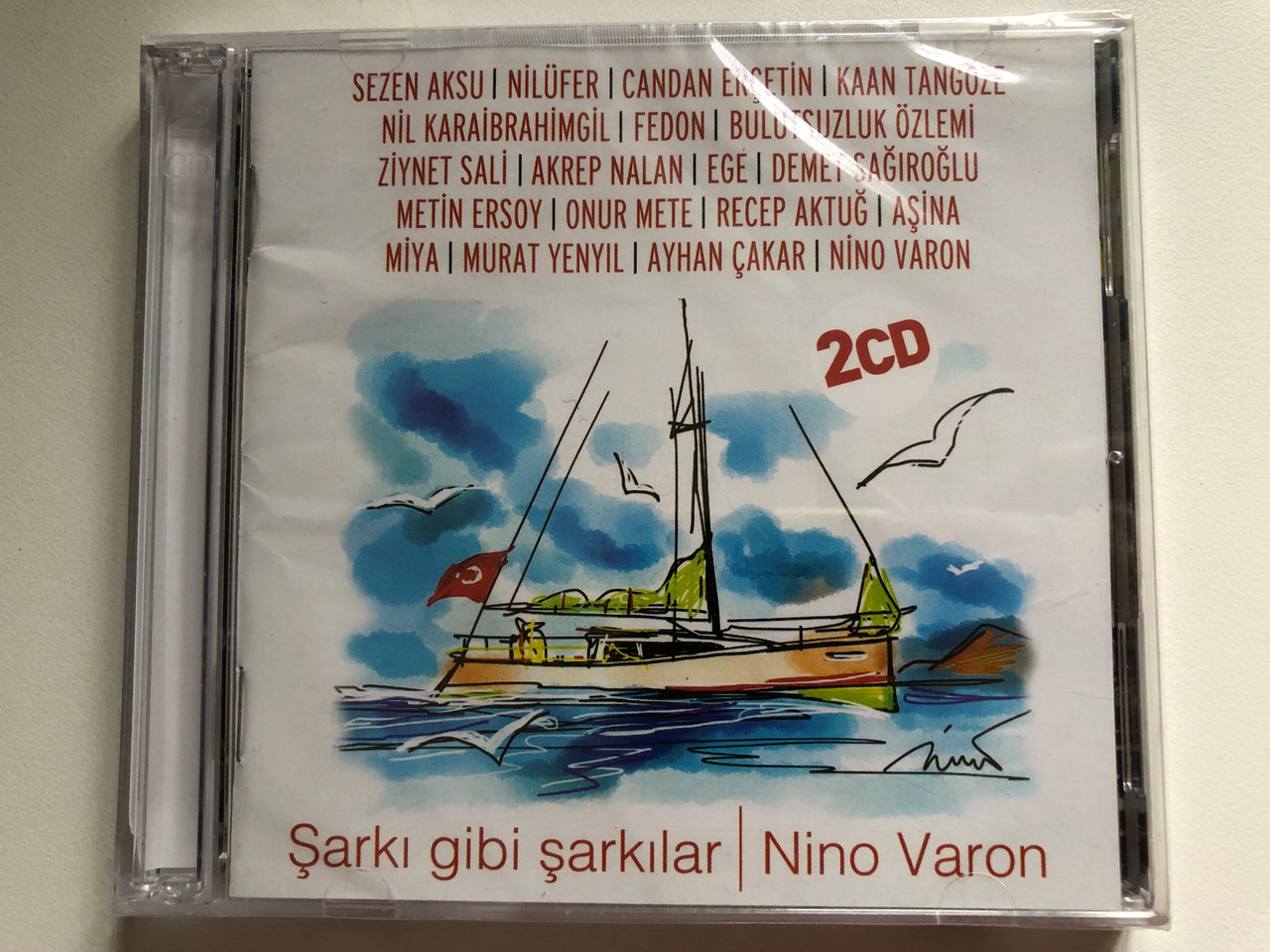 https://cdn10.bigcommerce.com/s-62bdpkt7pb/products/0/images/289750/Nino_Varon_ark_Gibi_arklar_Sezen_Aksu_Nilfer_Candan_Eretin_Kaan_Tangze_Nil_Karaibrahimgil_Fedon_Bulutsuzluk_zlemi_Ziynet_Sali_Akrep_Nalan_Ege_Demet_Sarolu_Metin_Ersoy_1__74955.1691075259.1280.1280.JPG?c=2&_gl=1*1e44zd8*_ga*MjA2NTIxMjE2MC4xNTkwNTEyNTMy*_ga_WS2VZYPC6G*MTY5MTA2ODU3My4xMDA1LjEuMTY5MTA3NDcwOS41NC4wLjA.