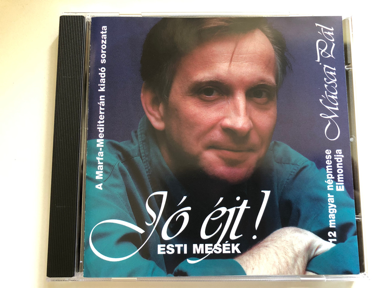 https://cdn10.bigcommerce.com/s-62bdpkt7pb/products/0/images/289778/Mcsai_Pl_J_jt_Esti_Mesk_-_12_Magyar_Npmese_Marfa-Mediterrn_Audio_CD_1998_MARFA_001_1__53468.1691077534.1280.1280.JPG?c=2&_gl=1*9wca3x*_ga*MjA2NTIxMjE2MC4xNTkwNTEyNTMy*_ga_WS2VZYPC6G*MTY5MTA2ODU3My4xMDA1LjEuMTY5MTA3NzU2NS42MC4wLjA.