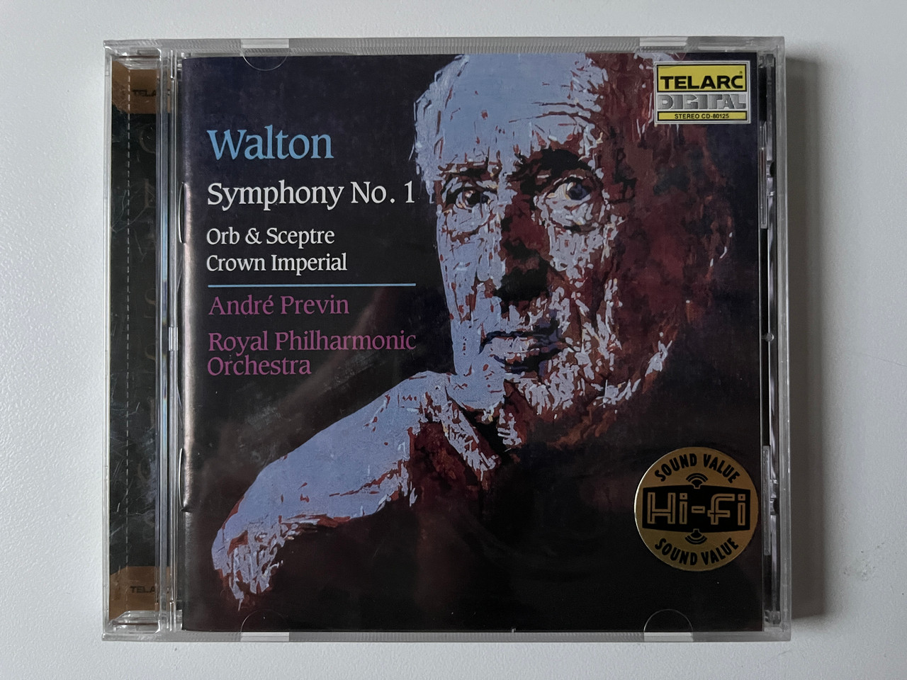 https://cdn10.bigcommerce.com/s-62bdpkt7pb/products/0/images/292145/Walton_-_Symphony_No._1_Orb_Sceptre_Crown_Imperial_-_Andr_Previn_The_Royal_Philharmonic_Orchestra_Telarc_Digital_Audio_CD_1987_CD-80125_1__91759.1691570175.1280.1280.jpg?c=2&_gl=1*1k04jdy*_ga*MjA2NTIxMjE2MC4xNTkwNTEyNTMy*_ga_WS2VZYPC6G*MTY5MTU3MDA2NS4xMDEzLjEuMTY5MTU3MDA4MS40NC4wLjA.