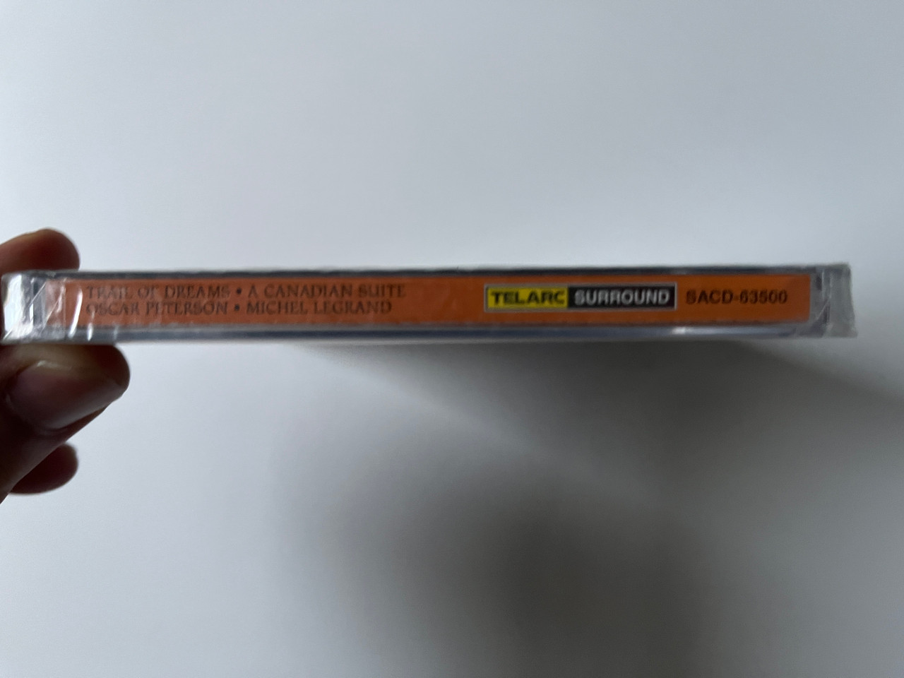 https://cdn10.bigcommerce.com/s-62bdpkt7pb/products/0/images/292153/Oscar_Peterson_Trail_Of_Dreams_-_A_Canadian_Suite_-_Michel_Legrand_Oscar_Peterson_Quartet_The_Michel_Legrand_Strings_Telarc_Hybrid_Disc_Stereo_SACD-63500_3__24055.1691571623.1280.1280.jpg?c=2&_gl=1*11z7ddk*_ga*MjA2NTIxMjE2MC4xNTkwNTEyNTMy*_ga_WS2VZYPC6G*MTY5MTU3MDA2NS4xMDEzLjEuMTY5MTU3MTU1OS42MC4wLjA.