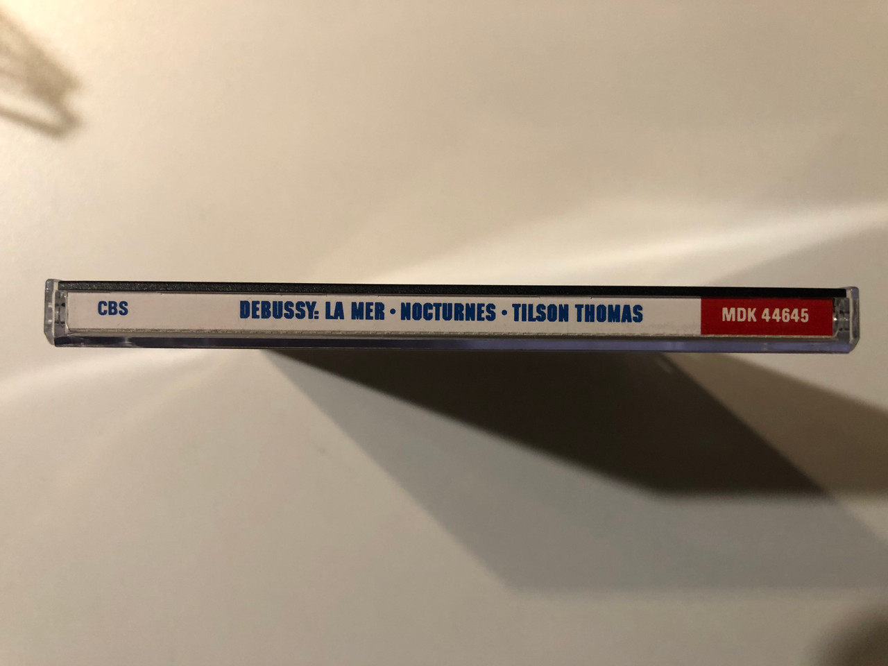 https://cdn10.bigcommerce.com/s-62bdpkt7pb/products/0/images/292619/Debussy_-_La_Mer_Nocturnes_-_Ambrosian_Singers_Philharmonia_Orchestra_Michael_Tilson_Thomas_Digital_Masters_CBS_Masterworks_Audio_CD_1988_MDK_44645_3__89824.1691729396.1280.1280.JPG?c=2&_gl=1*c4hhe3*_ga*MjA2NTIxMjE2MC4xNTkwNTEyNTMy*_ga_WS2VZYPC6G*MTY5MTcyNjMyMS4xMDE3LjEuMTY5MTcyOTI2NC41Mi4wLjA.