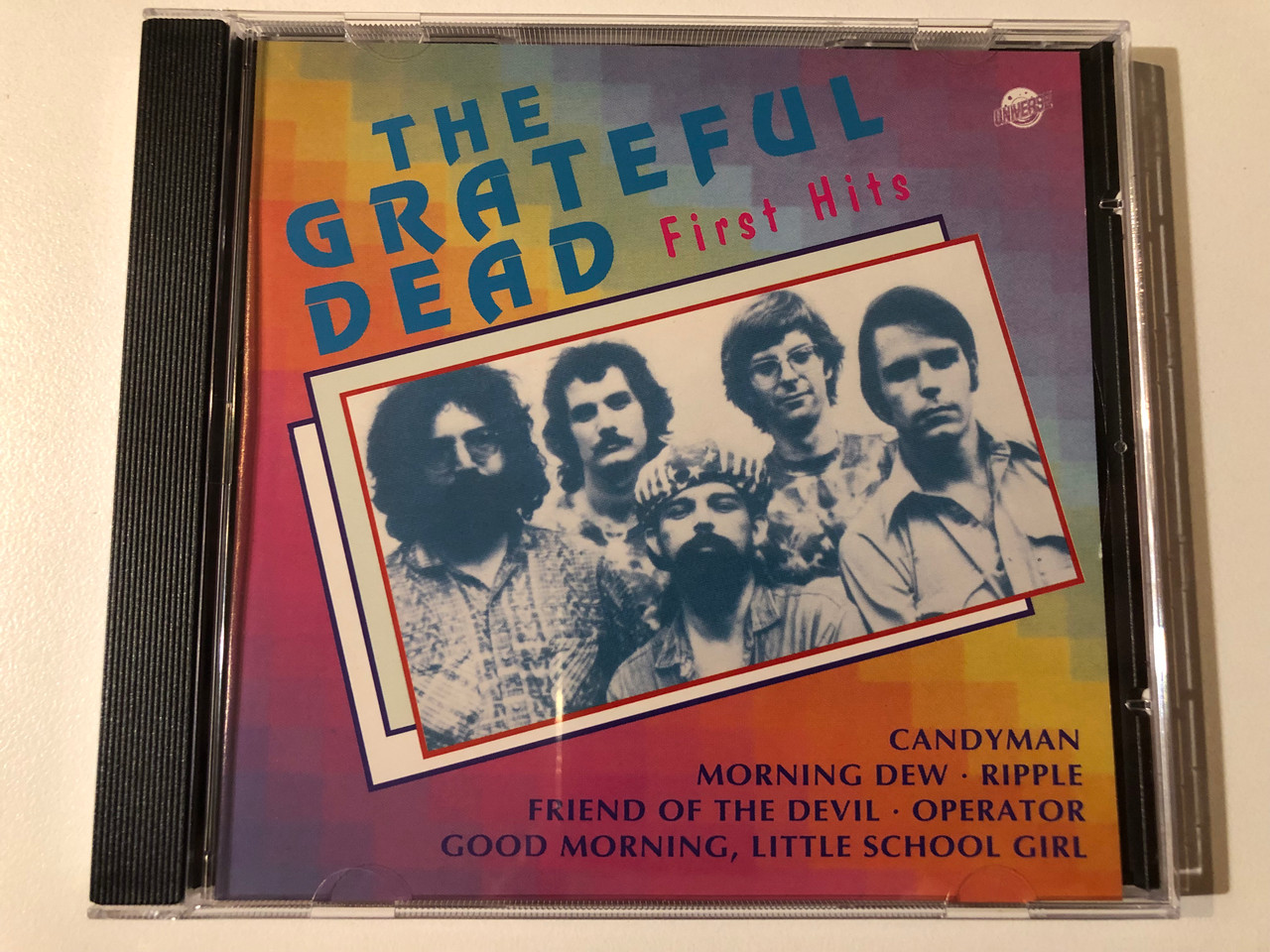 https://cdn10.bigcommerce.com/s-62bdpkt7pb/products/0/images/293090/The_Grateful_Dead_First_Hits_Candyman_Morning_Dew_Ripple_Friend_Of_The_Devil_Operator_Good_Morning_Little_School_Girl_Universe_Audio_CD_Stereo_UN_3_119_1__20641.1691998898.1280.1280.JPG?c=2&_gl=1*1enae1g*_ga*MjA2NTIxMjE2MC4xNTkwNTEyNTMy*_ga_WS2VZYPC6G*MTY5MTk5MzQwNS4xMDE5LjEuMTY5MTk5ODU5Ni4zNy4wLjA.