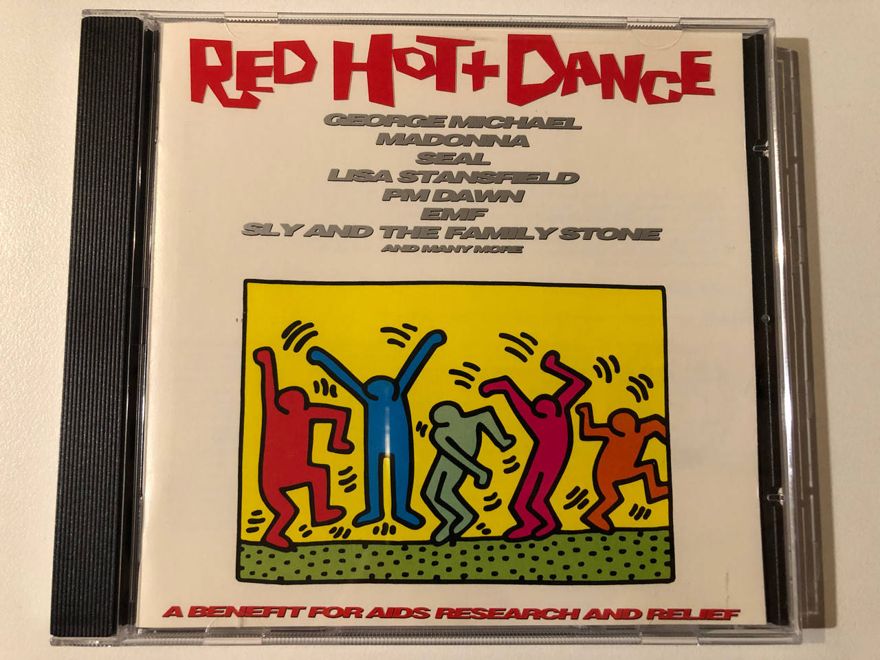 https://cdn10.bigcommerce.com/s-62bdpkt7pb/products/0/images/293123/Red_Hot_Dance_-_George_Michael_Madonna_Seal_Lisa_Stansfield_P.M._Dawn_EMF_Sly_The_Family_Stone_And_Many_More_A_Benefit_For_AIDS_Research_And_Relief_Epic_Audio_CD_1992_471821_2_1__76027.1692007581.1280.1280.JPG?c=2&_gl=1*d2y4aq*_ga*MjA2NTIxMjE2MC4xNTkwNTEyNTMy*_ga_WS2VZYPC6G*MTY5MjAwNDU0MC4xMDIwLjEuMTY5MjAwNzMwMi40Ni4wLjA.