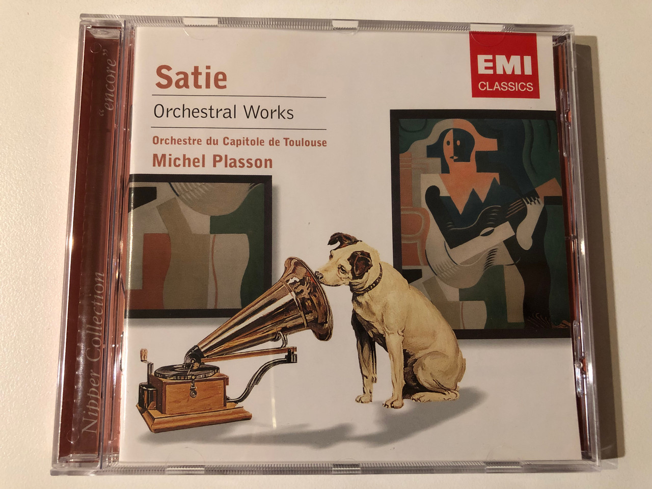 https://cdn10.bigcommerce.com/s-62bdpkt7pb/products/0/images/293250/Satie_-_Orchestral_Works_-_Orchestre_Du_Capitole_De_Toulouse_Michel_Plasson_Encore._Nipper_Collection_EMI_Classics_Audio_CD_2006_Stereo_094634144322_1__00614.1692090031.1280.1280.JPG?c=2&_gl=1*b3m4wo*_ga*MjA2NTIxMjE2MC4xNTkwNTEyNTMy*_ga_WS2VZYPC6G*MTY5MjA4OTM2OC4xMDIzLjEuMTY5MjA5MDAzMC42MC4wLjA.