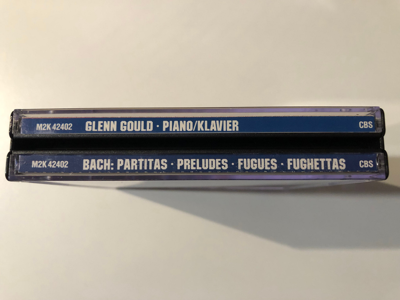 https://cdn10.bigcommerce.com/s-62bdpkt7pb/products/0/images/294323/Glenn_Gould_piano_-_Bach_The_Partitas_Preludes_Fugues_Fughettas_CBS_Masterworks_2x_Audio_CD_1987_M2K_42402_3__16173.1692338221.1280.1280.JPG?c=2&_gl=1*19cwmfq*_ga*MjA2NTIxMjE2MC4xNTkwNTEyNTMy*_ga_WS2VZYPC6G*MTY5MjMzNTU2Ny4xMDM1LjEuMTY5MjMzNzg1Mi4xMS4wLjA.