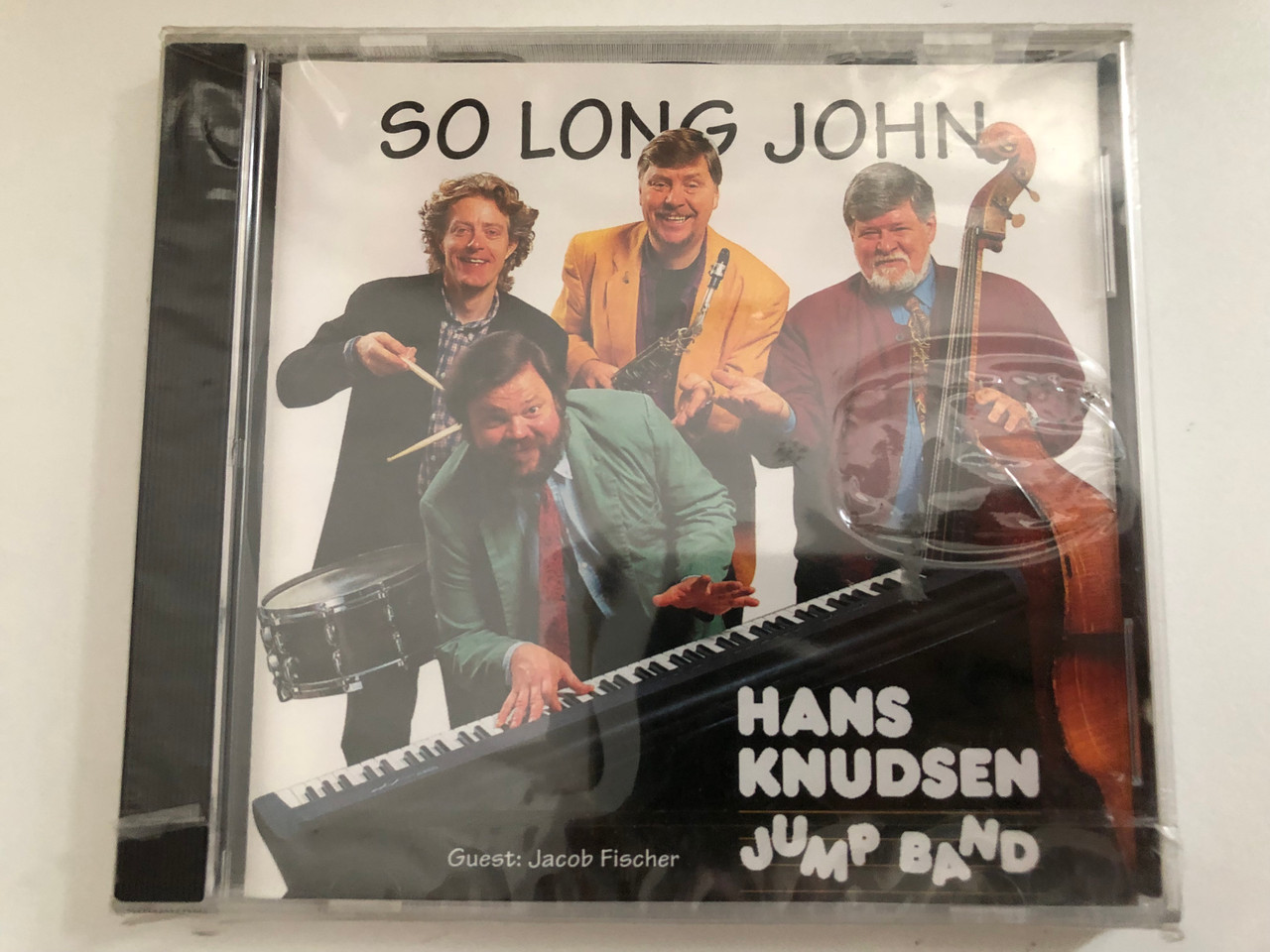https://cdn10.bigcommerce.com/s-62bdpkt7pb/products/0/images/294878/So_Long_John_-_Hans_Knudsen_Jump_Band_Guest_Jacob_Fischer_Music_Mecca_Audio_CD_1994_CD_1063-2_1__33357.1692684876.1280.1280.JPG?c=2&_gl=1*1eocvx0*_ga*MjA2NTIxMjE2MC4xNTkwNTEyNTMy*_ga_WS2VZYPC6G*MTY5MjY4MjY1Ni4xMDM5LjEuMTY5MjY4NDczNi41My4wLjA.