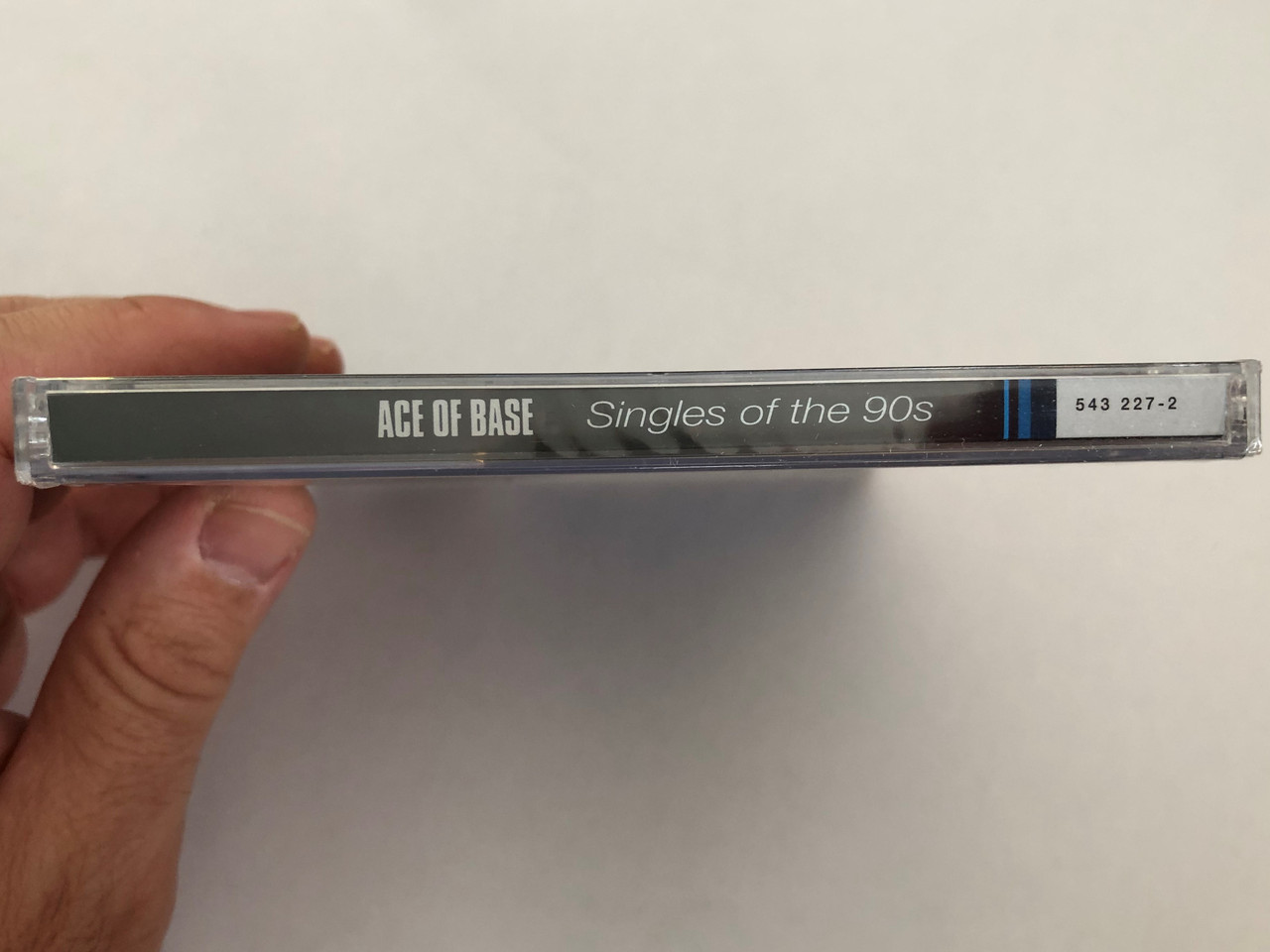 https://cdn10.bigcommerce.com/s-62bdpkt7pb/products/0/images/294987/Ace_Of_Base_Singles_Of_The_90s_Universal_Audio_CD_1999_543_227-2_3__24658.1692691999.1280.1280.JPG?c=2&_gl=1*y0wnzu*_ga*MjA2NTIxMjE2MC4xNTkwNTEyNTMy*_ga_WS2VZYPC6G*MTY5MjY4MjY1Ni4xMDM5LjEuMTY5MjY5MDQ3My41NS4wLjA.