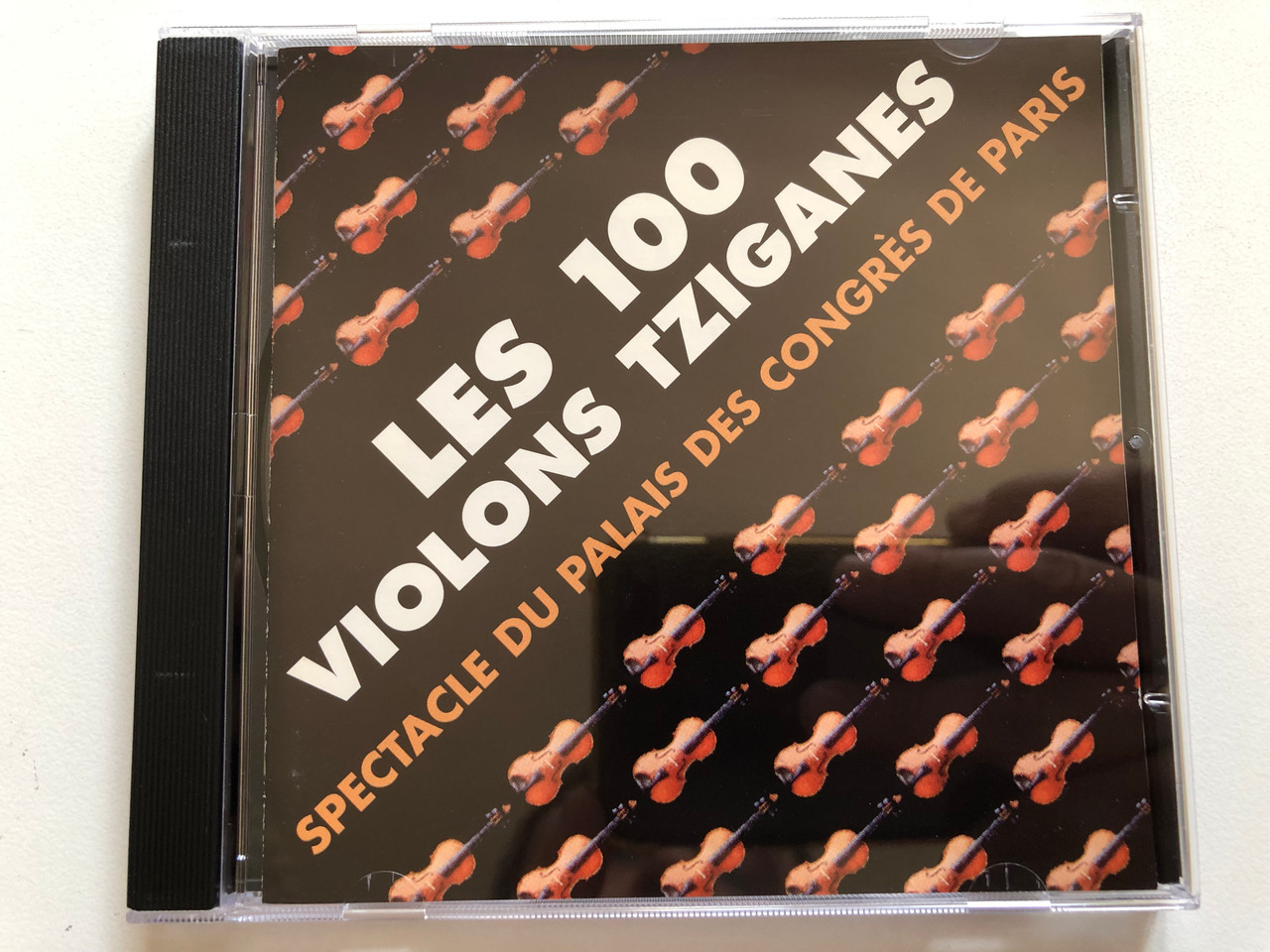 https://cdn10.bigcommerce.com/s-62bdpkt7pb/products/0/images/295434/Les_100_Violons_Tziganes_Spectacle_Du_Palais_Des_Congrs_De_Paris_EMI_France_Audio_CD_1995_8328302_1__87168.1692870303.1280.1280.JPG?c=2&_gl=1*h7un1i*_ga*MjA2NTIxMjE2MC4xNTkwNTEyNTMy*_ga_WS2VZYPC6G*MTY5Mjg2NTAxNC4xMDQzLjEuMTY5Mjg3MDI3My42MC4wLjA.