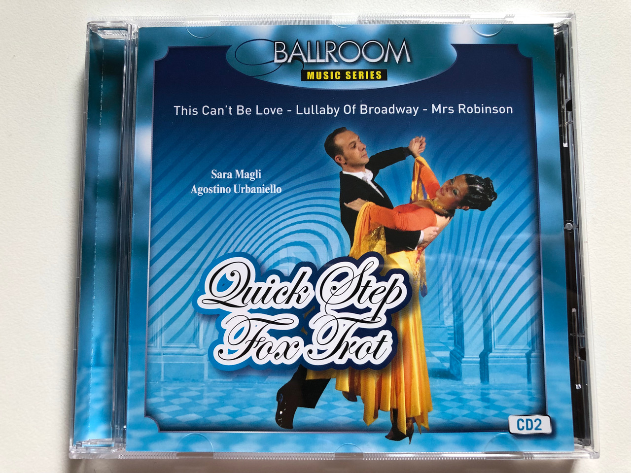 https://cdn10.bigcommerce.com/s-62bdpkt7pb/products/0/images/297693/Quick_Step_-_Fox_Trot_CD_2_-_Sara_Magli_Agostino_Urbaniello_This_Cant_Be_Love_Lullaby_Of_Broadway_Mrs_Robinson_Azzurra_Music_Srl_Audio_CD_2007_TBPB1001_1__75877.1693504728.1280.1280.JPG?c=2&_gl=1*1i4i1k5*_ga*MjA2NTIxMjE2MC4xNTkwNTEyNTMy*_ga_WS2VZYPC6G*MTY5MzQ5ODY0MC4xMDU0LjEuMTY5MzUwNDQ5OS41OS4wLjA.