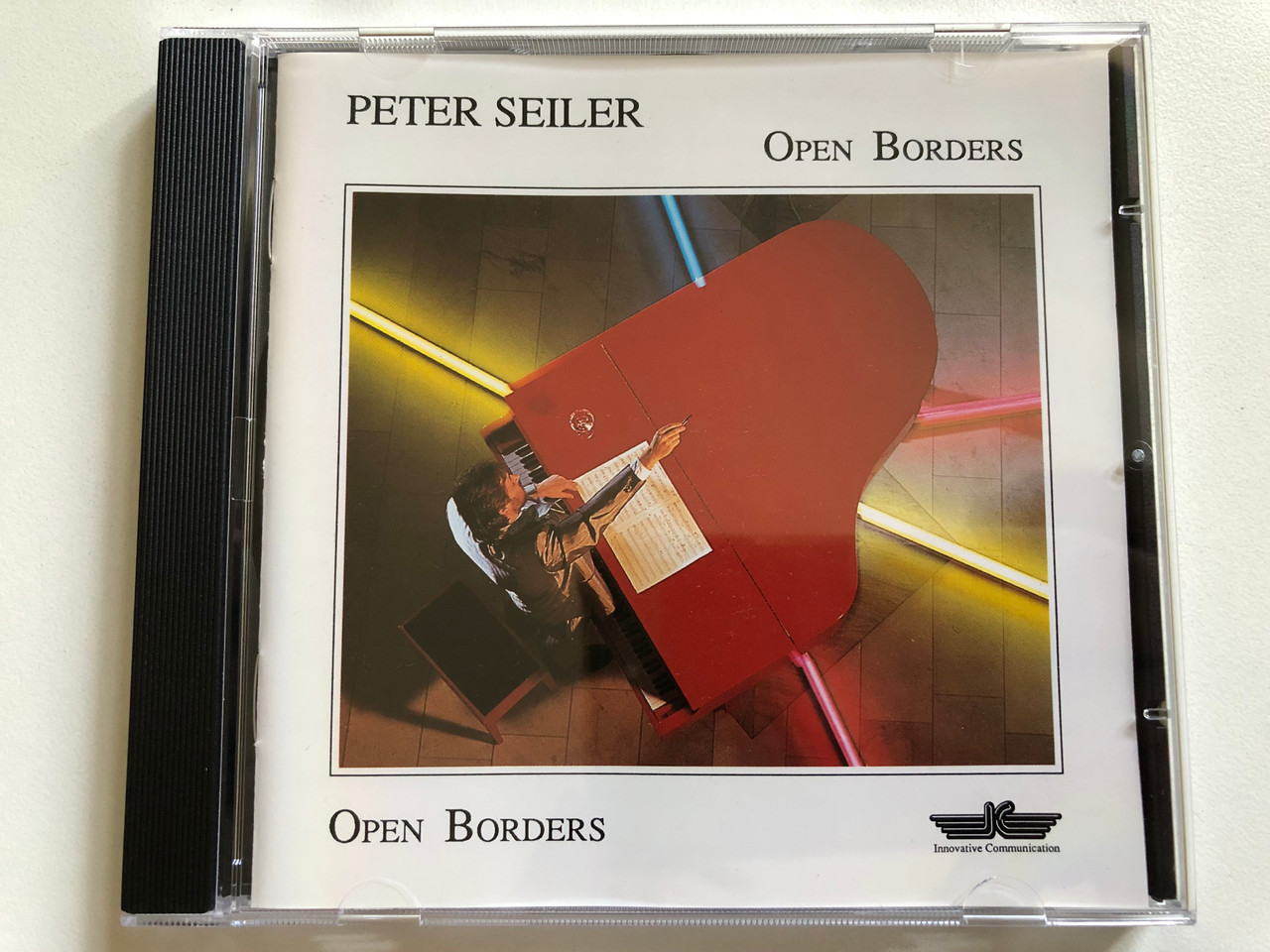 https://cdn10.bigcommerce.com/s-62bdpkt7pb/products/0/images/297777/Peter_Seiler_Open_Borders_Innovative_Communication_Audio_CD_1991_IC_710_1__13898.1693514136.1280.1280.JPG?c=2&_gl=1*jp06sw*_ga*MjA2NTIxMjE2MC4xNTkwNTEyNTMy*_ga_WS2VZYPC6G*MTY5MzQ5ODY0MC4xMDU0LjEuMTY5MzUxNDA1MC41OS4wLjA.