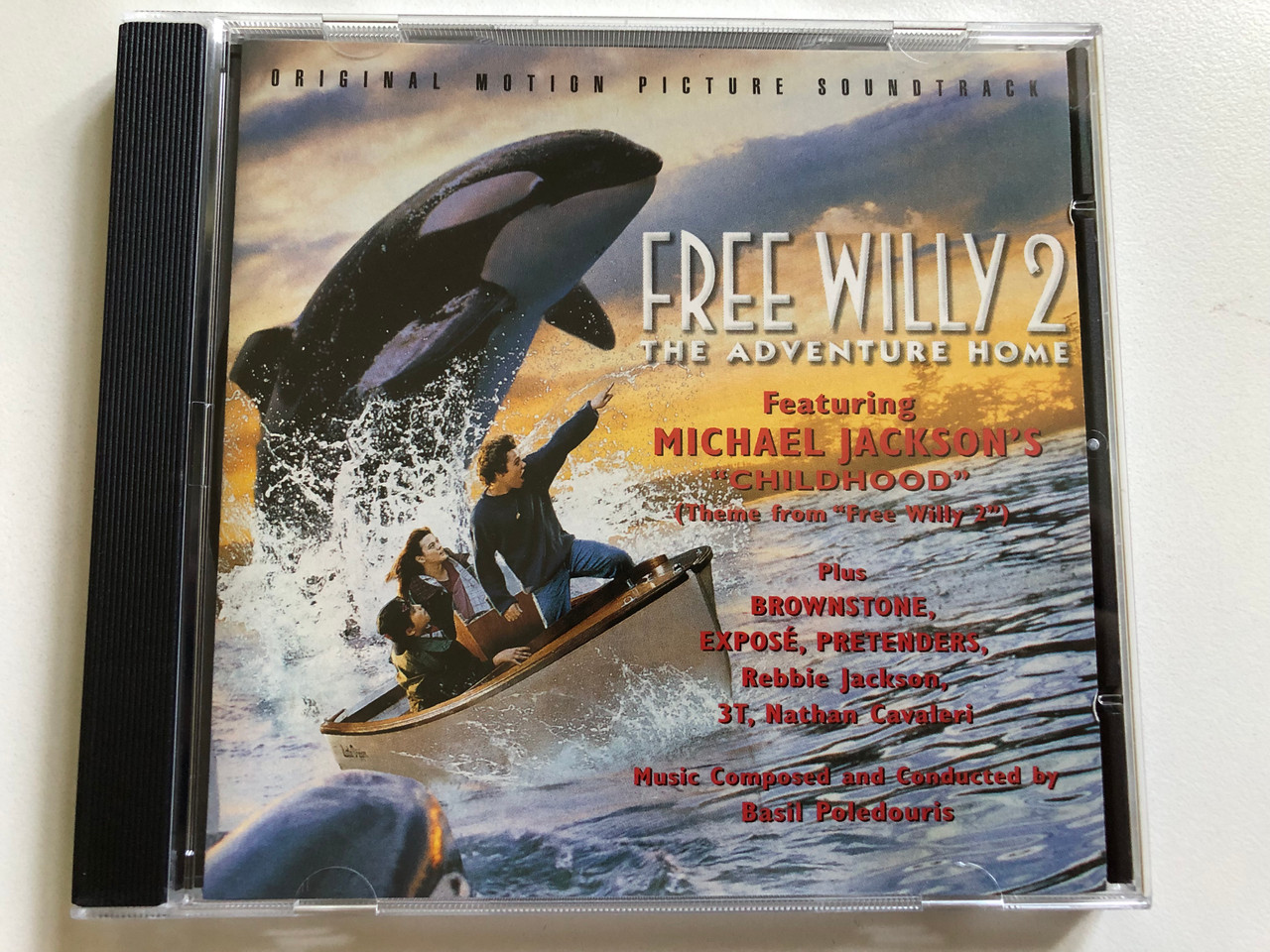 https://cdn10.bigcommerce.com/s-62bdpkt7pb/products/0/images/298371/Free_Willy_2_The_Adventure_Home_Original_Motion_Picture_Soundtrack_-_Music_Composed_and_Conducted_by_Basil_Poledouris_Featuring_Michael_Jacksons_Childhood_Theme_from_Free_Willy_2_1__97409.1693808947.1280.1280.JPG?c=2&_gl=1*u0zipz*_ga*MjA2NTIxMjE2MC4xNTkwNTEyNTMy*_ga_WS2VZYPC6G*MTY5MzgwNzIzNy4xMDU2LjEuMTY5MzgwODU1MS40OC4wLjA.