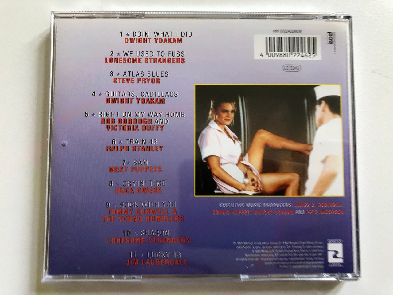 https://cdn10.bigcommerce.com/s-62bdpkt7pb/products/0/images/298384/Berenger_Eleniak_McNamara_Chasers_Motion_Picture_Soundtrack_-_Score_Composed_By_Dwight_Yoakam_And_Pete_Anderson_edel_Audio_CD_0022462MCM_2__31351.1693811028.1280.1280.JPG?c=2&_gl=1*1lbjkqb*_ga*MjA2NTIxMjE2MC4xNTkwNTEyNTMy*_ga_WS2VZYPC6G*MTY5MzgwNzIzNy4xMDU2LjEuMTY5MzgxMDcyMy42MC4wLjA.