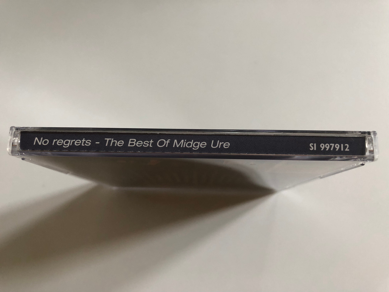 https://cdn10.bigcommerce.com/s-62bdpkt7pb/products/0/images/298751/No_Regrets_-_The_Best_Of_Midge_Ure_No_Regrets_If_I_Was_The_Man_Who_Sold_The_World_That_Certain_Smile_Disky_Audio_CD_2000_SI_997912_3__43690.1693905020.1280.1280.JPG?c=2&_gl=1*1bui2iv*_ga*MjA2NTIxMjE2MC4xNTkwNTEyNTMy*_ga_WS2VZYPC6G*MTY5Mzg5NzkwOS4xMDU5LjEuMTY5MzkwNDk3OS42MC4wLjA.