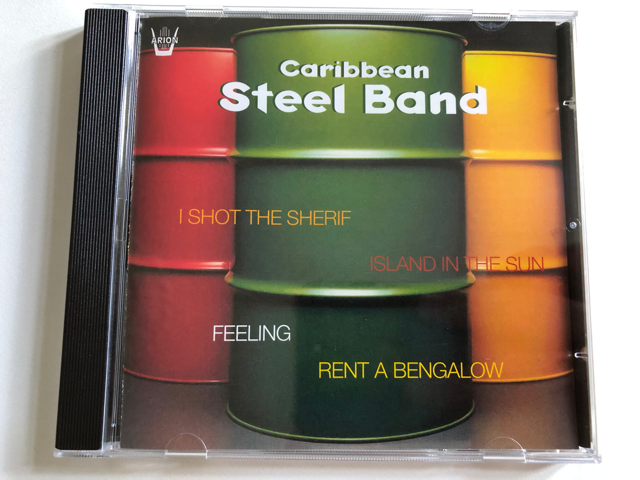 https://cdn10.bigcommerce.com/s-62bdpkt7pb/products/0/images/298966/Caribbean_Steel_Band_-_I_Shot_The_Sherif_Island_In_The_Sun_Feeling_Rent_A_Bengalow_Arion_Audio_CD_2007_ARN_64750_1__12450.1693977841.1280.1280.JPG?c=2&_gl=1*1q97f78*_ga*MjA2NTIxMjE2MC4xNTkwNTEyNTMy*_ga_WS2VZYPC6G*MTY5Mzk3NjAyOS4xMDYwLjEuMTY5Mzk3NzY1NS4zNi4wLjA.