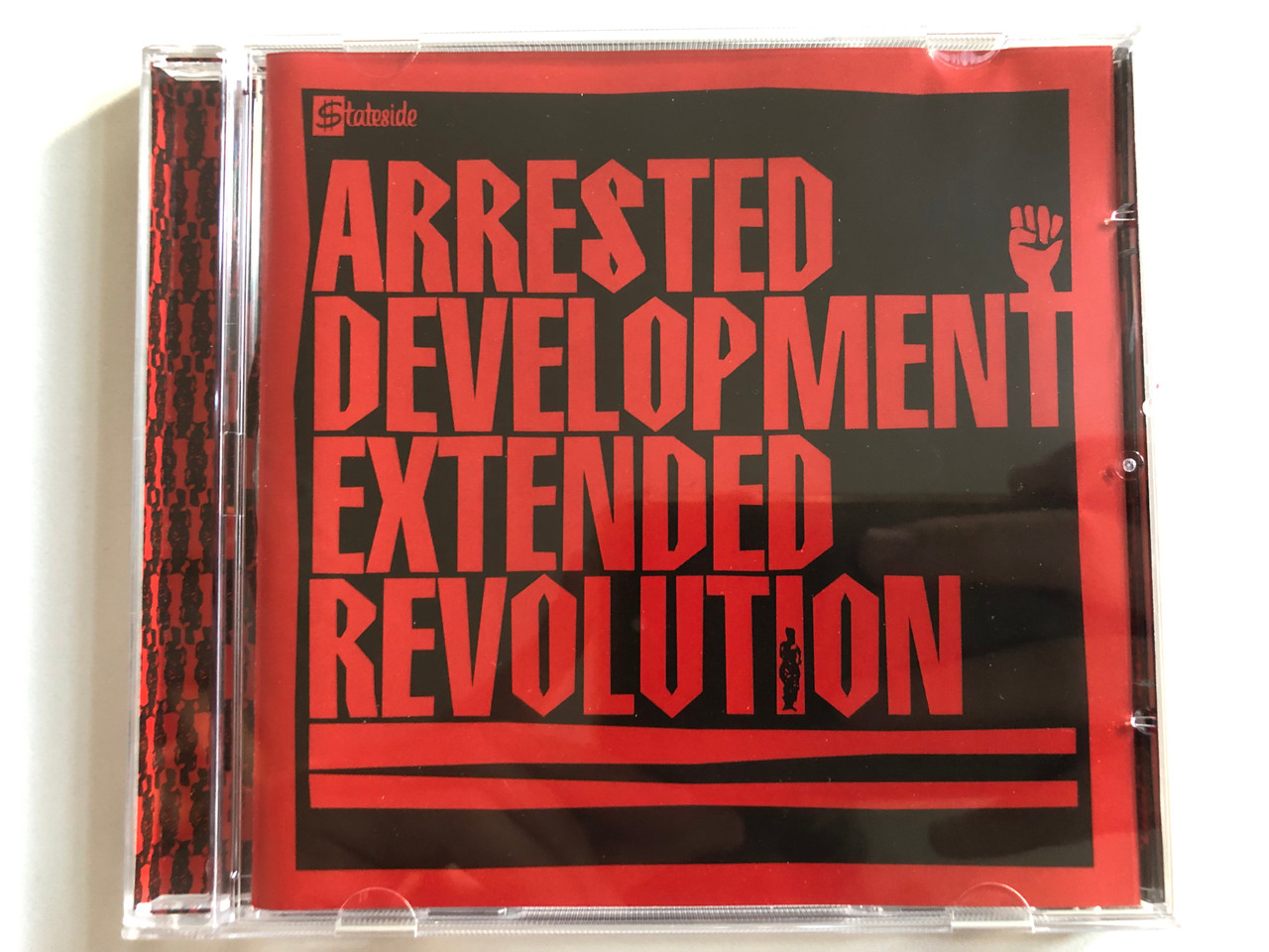 https://cdn10.bigcommerce.com/s-62bdpkt7pb/products/0/images/299145/Arrested_Devel_Opment_Extended_Revolution_Stateside_Audio_CD_2003_7243-5-38858-2-3_1__60423.1694066150.1280.1280.JPG?c=2&_gl=1*1k5k7lw*_ga*MjA2NTIxMjE2MC4xNTkwNTEyNTMy*_ga_WS2VZYPC6G*MTY5NDA2MzU2NS4xMDYxLjEuMTY5NDA2NTkyNC40MS4wLjA.
