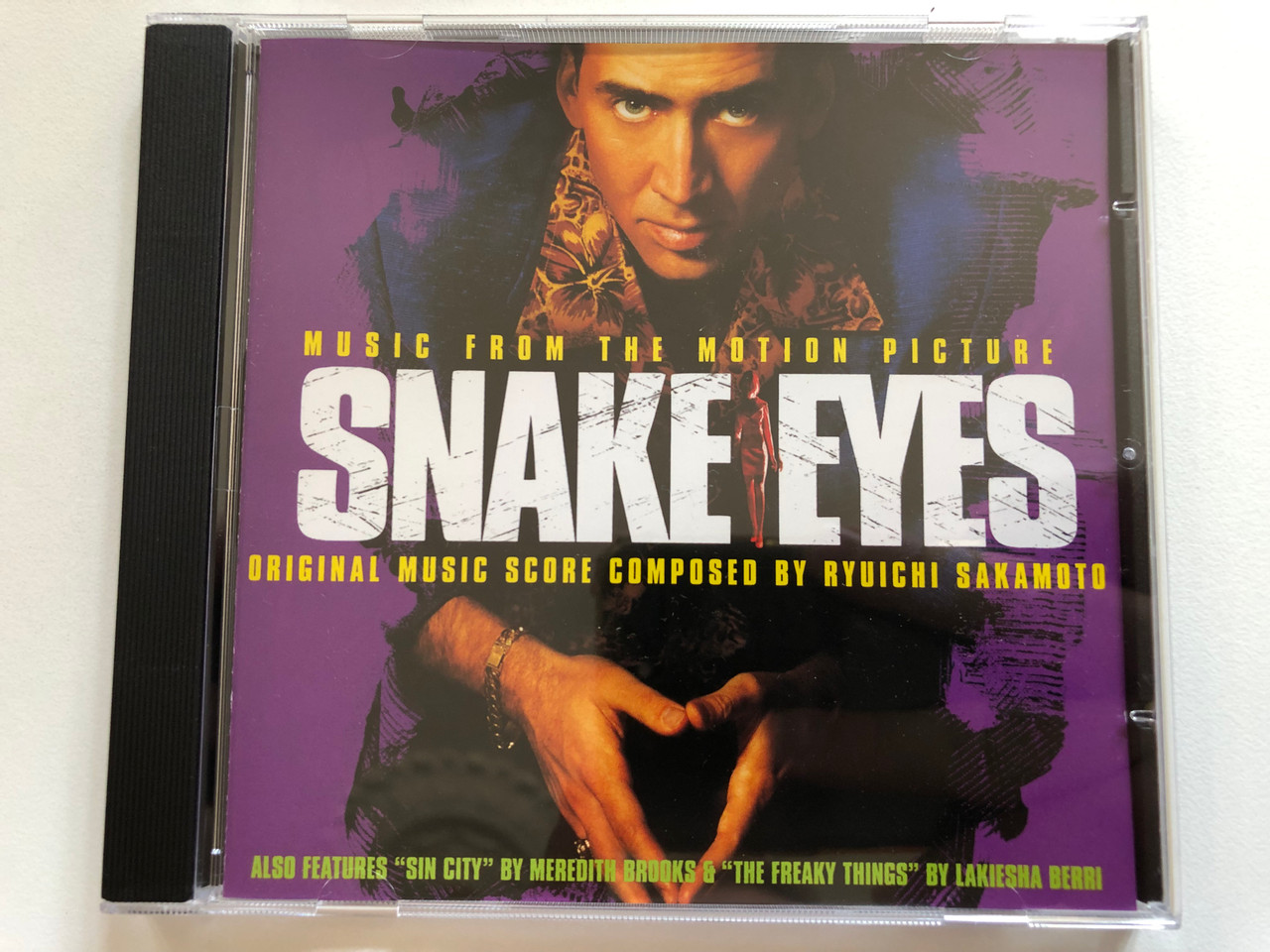 https://cdn10.bigcommerce.com/s-62bdpkt7pb/products/0/images/299320/Snake_Eyes_Music_From_The_Motion_Picture_-_Original_Music_Score_Composed_By_Ryuichi_Sakamoto_Also_Features_Sin_City_By_Meredith_Brooks_The_Freakly_Things_By_Lakiesha_Berri_Holly_1__00859.1694157544.1280.1280.JPG?c=2&_gl=1*bmdtuy*_ga*MjA2NTIxMjE2MC4xNTkwNTEyNTMy*_ga_WS2VZYPC6G*MTY5NDE0NDQwMy4xMDYzLjEuMTY5NDE1NzMyMi4zNS4wLjA.