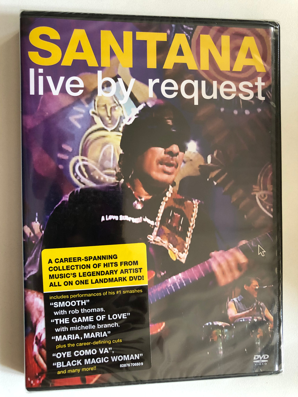 https://cdn10.bigcommerce.com/s-62bdpkt7pb/products/0/images/300299/Santana_Live_By_Request_A_Career-Spanning_Collection_Of_Hits_From_Musics_Legendary_Artist_All_On_One_Lendmark_DVD_Includes_performances_of_his_1_smashes_Smooth_with_Rob_Thomas_T_1__08136.1694442376.1280.1280.JPG?c=2&_gl=1*r6k6wh*_ga*MjA2NTIxMjE2MC4xNTkwNTEyNTMy*_ga_WS2VZYPC6G*MTY5NDQzODQ4OC4xMDY0LjEuMTY5NDQ0MjEyNC41OC4wLjA.
