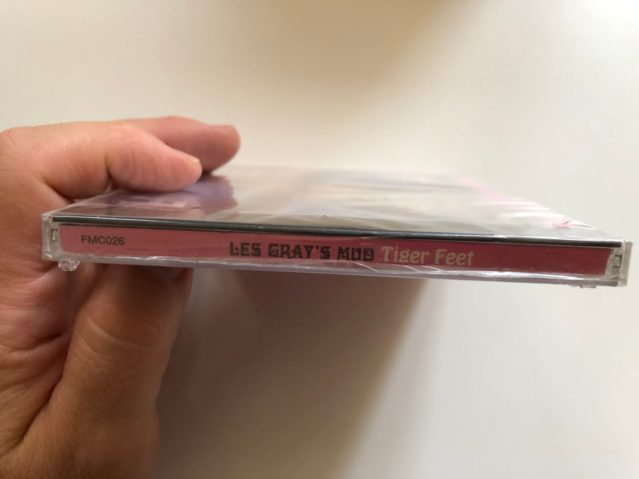 https://cdn10.bigcommerce.com/s-62bdpkt7pb/products/0/images/300310/Les_Grays_Mud_-_Tiger_Feet_Including_Dynamite_Rocket_Lonely_This_Christmas_FMCG_Audio_CD_1997_FMC026_3__78496.1694449576.1280.1280.JPG?c=2&_gl=1*j3r7qb*_ga*MjA2NTIxMjE2MC4xNTkwNTEyNTMy*_ga_WS2VZYPC6G*MTY5NDQ0ODU0Ny4xMDY1LjEuMTY5NDQ0OTU1Ny42MC4wLjA.