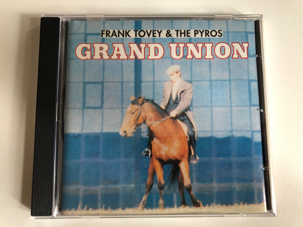 https://cdn10.bigcommerce.com/s-62bdpkt7pb/products/0/images/300864/Frank_Tovey_The_Pyros_Grand_Union_Mute_Audio_CD_1991_CD_Stumm_84_1__02470.1694535125.1280.1280.JPG?c=2&_gl=1*1q0hx52*_ga*MjA2NTIxMjE2MC4xNTkwNTEyNTMy*_ga_WS2VZYPC6G*MTY5NDUzMzc3OS4xMDY3LjEuMTY5NDUzNDk5MS40OS4wLjA.