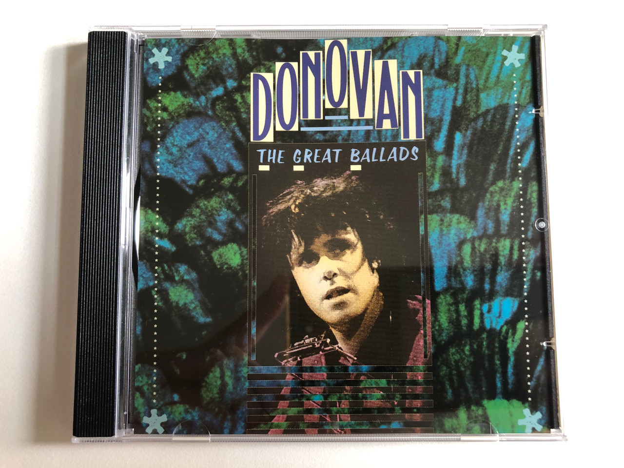 https://cdn10.bigcommerce.com/s-62bdpkt7pb/products/0/images/300877/Donovan_The_Great_Ballads_PRT_Audio_CD_1988_8.26881_ZR_1__26580.1694536773.1280.1280.JPG?c=2&_gl=1*z4mnei*_ga*MjA2NTIxMjE2MC4xNTkwNTEyNTMy*_ga_WS2VZYPC6G*MTY5NDUzMzc3OS4xMDY3LjEuMTY5NDUzNjc3NC42MC4wLjA.