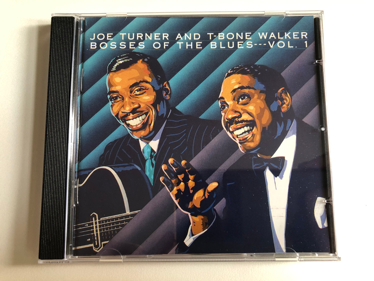 https://cdn10.bigcommerce.com/s-62bdpkt7pb/products/0/images/300898/Joe_Turner_And_T-Bone_Walker_Bosses_Of_The_Blues---Vol.1_Bluebird_Audio_CD_1989_ND88311_1__53755.1694540480.1280.1280.JPG?c=2&_gl=1*f7mltq*_ga*MjA2NTIxMjE2MC4xNTkwNTEyNTMy*_ga_WS2VZYPC6G*MTY5NDUzMzc3OS4xMDY3LjEuMTY5NDU0MDM2MS40OC4wLjA.