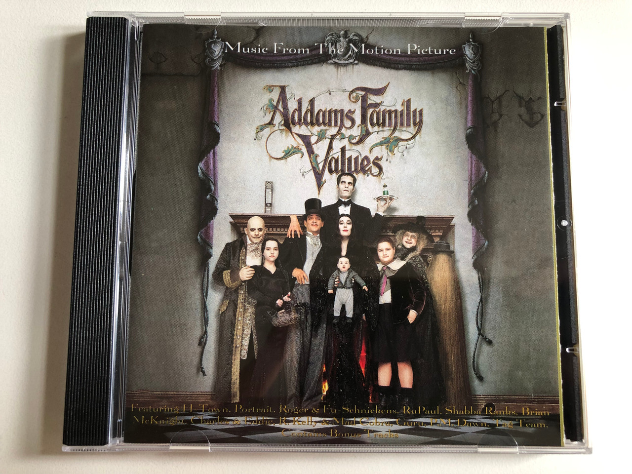 https://cdn10.bigcommerce.com/s-62bdpkt7pb/products/0/images/301637/Addams_Family_Values_Music_From_The_Motion_Picture_-_Featuring_H-Town_PortraitRoger_Fu-Schnickens_RuPaul_Shabba_Ranks_Brian_Mcknight_Charles_Eddie_R._Kelly_Mad_Cobra_Guru_P_1__50106.1695725789.1280.1280.JPG?c=2&_gl=1*i1rg9o*_ga*MjA2NTIxMjE2MC4xNTkwNTEyNTMy*_ga_WS2VZYPC6G*MTY5NTcyMjYwMy4xMDY5LjEuMTY5NTcyNTM5MS4yMy4wLjA.