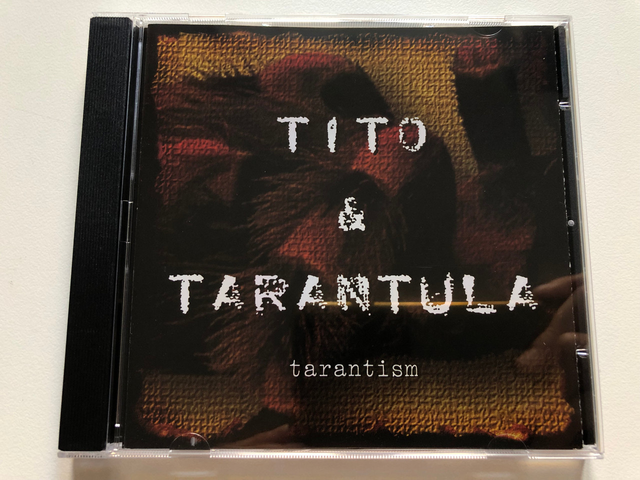 https://cdn10.bigcommerce.com/s-62bdpkt7pb/products/0/images/301980/Tito_Tarantula_Tarantism_Goldrush_Audio_CD_1997_NUGGET_015_1__35366.1695879831.1280.1280.JPG?c=2&_gl=1*1wa0yz1*_ga*MjA2NTIxMjE2MC4xNTkwNTEyNTMy*_ga_WS2VZYPC6G*MTY5NTg3OTIyMC4xMDc1LjEuMTY5NTg3OTY5OC41OS4wLjA.