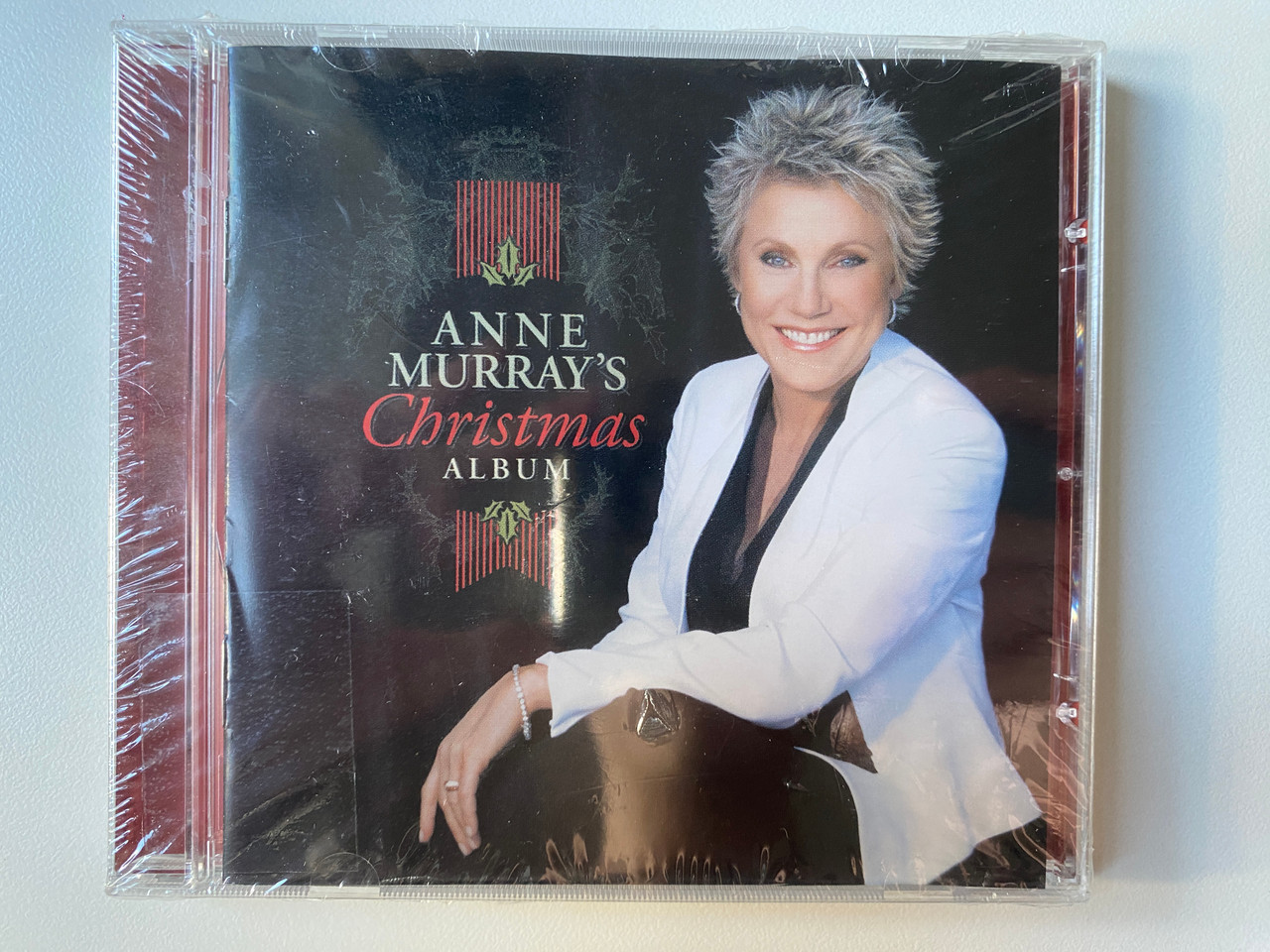 https://cdn10.bigcommerce.com/s-62bdpkt7pb/products/0/images/302074/Anne_Murrays_Christmas_Album_EMI_Audio_CD_2008_5-09992-27642-25_1__01077.1695972963.1280.1280.jpg?c=2&_gl=1*1u8ukex*_ga*MjA2NTIxMjE2MC4xNTkwNTEyNTMy*_ga_WS2VZYPC6G*MTY5NTk2Nzc2My4xMDc2LjEuMTY5NTk3MjQ5My41MS4wLjA.